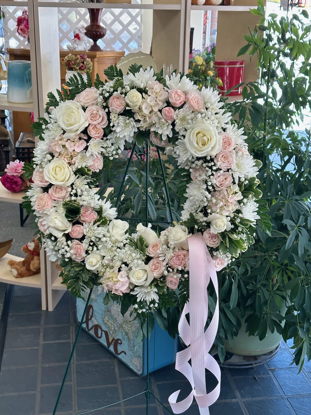 Whispers From Heaven - This wreath has whispers of soft pink and whites is sure to bring comfort. 