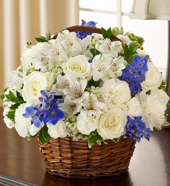 Peace, Prayers &amp; Blessings - Blue and White - Product ID: 95413   Offer peace and comforting prayers during times of loss with this elegant blue and white basket arrangement. A pair of graceful doves sits atop a gathering of fresh roses, delphinium, alstroemeria and carnations, beautifully hand-designed by our florists. Please note: doves are available in select areas only. Check with your local florist. Graceful blue and white arrangement of roses, delphinium, alstroemeria, carnations, mini carnations and monte casino, accented with variegated pittosporum and myrtle Hand-arranged in a willow handled basket with a pair of peaceful white dove picks; basket measures 8"H Appropriate to send to the home of friends and family members or to the memorial service Large arrangement measures approximately 12"H x 12"L Medium arrangement measures approximately 11"H x 11"L Small arrangement measures approximately 10"H X 10"L Our florists hand-design each arrangement, so colors, varieties, and basket may vary due to local availability Lilies may arrive in bud form and will open to full beauty over the next 2-3 days