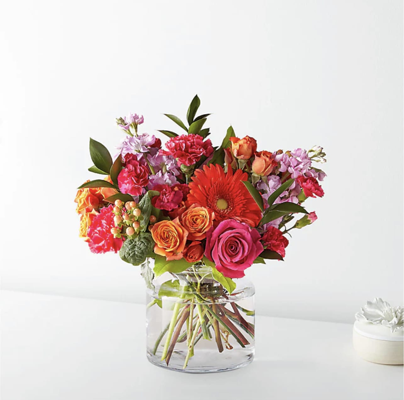 Fiesta Bouquet - The Fiesta Bouquet is composed of a lively mix, fit to celebrate any and every moment. With a combination of vibrant flowers, this florist–designed arrangement brings a pop of color and a burst of excitement as soon as it arrives.