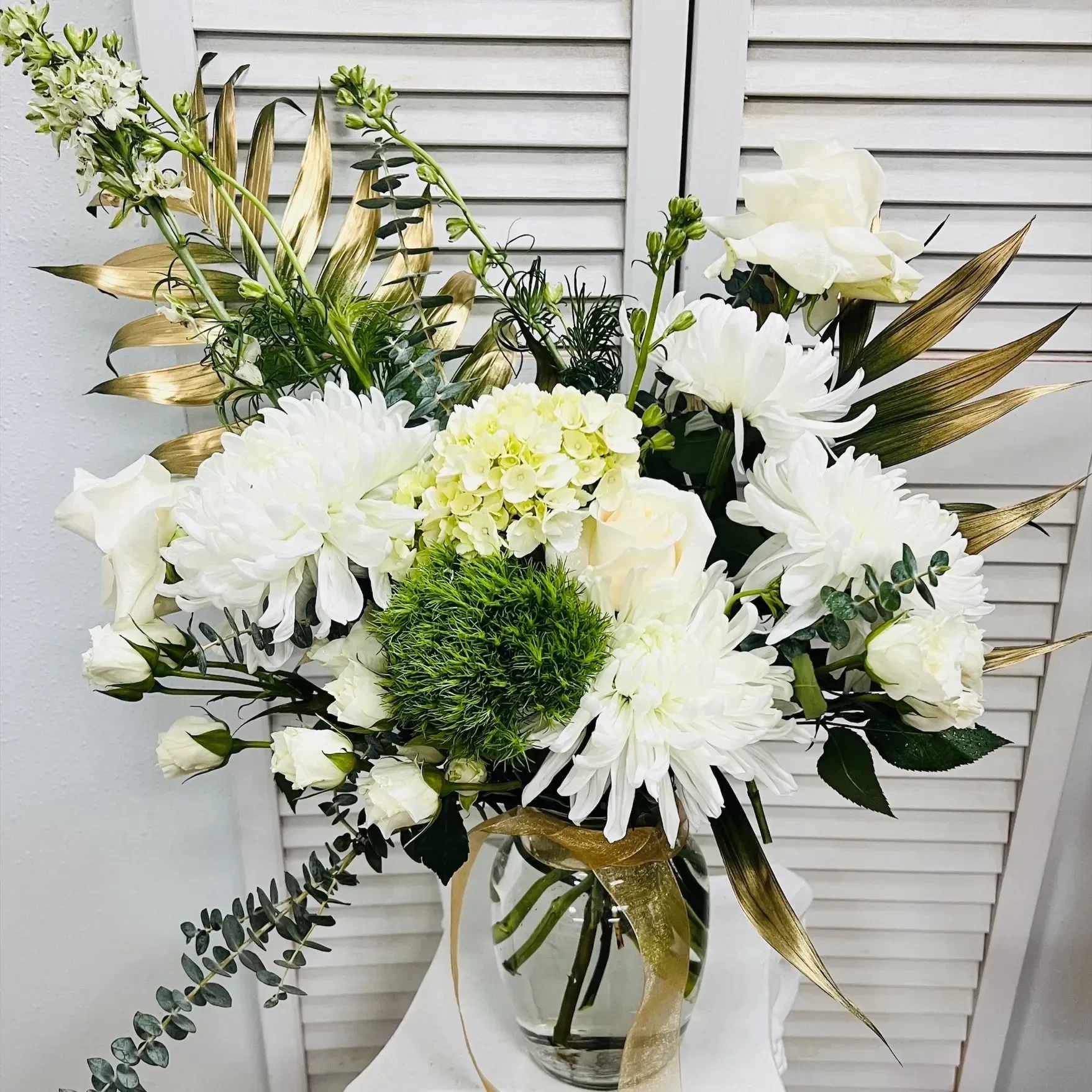 The Berkey - Send this stylish arrangement for any occasion! Reflexed roses, hydrangea, and chrysanthemum creates a wonderful presentation of seasonal flowers!  Similar Substitutions of equal or higher value and color will be made if we cannot source flowers shown for this arrangement. The arrangement style and shape will stay as close as possible.