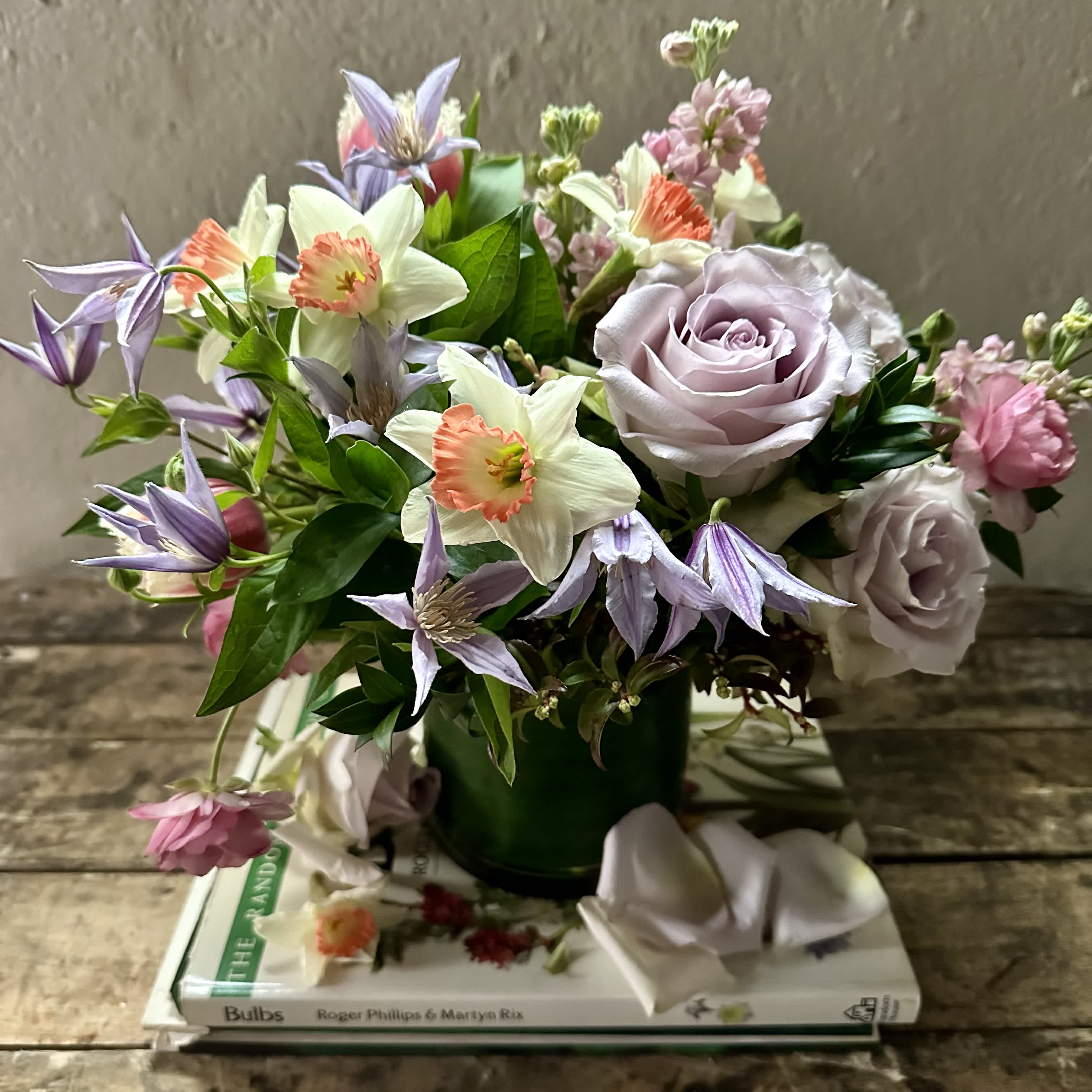 Springtime Pleasure - Spring daffodils, lavender roses, clematis and ranunculus.
