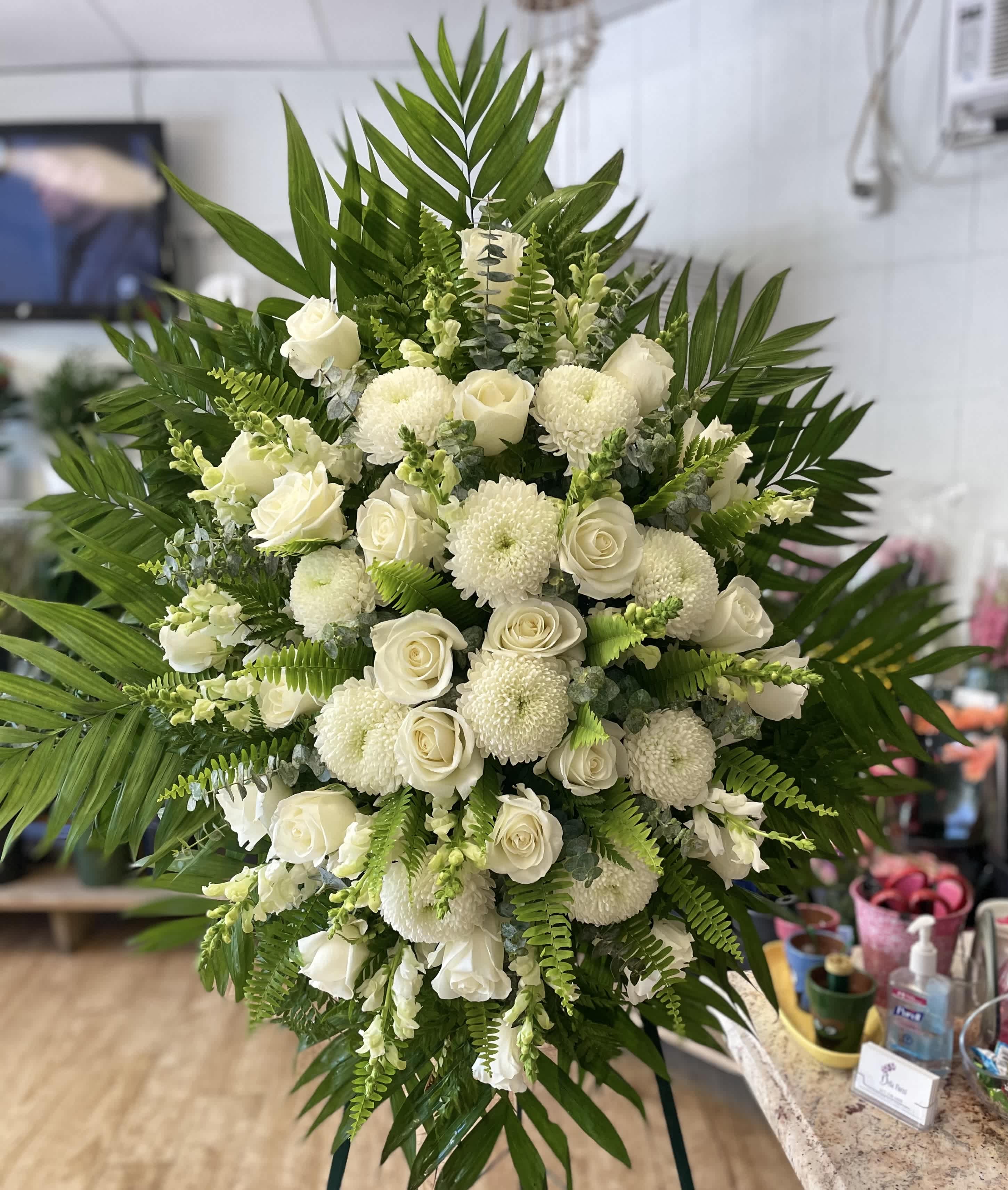 Standing Spray 15 - Foliage includes: Rose, Chrysanthemum, Snapdragon, Boston Fern and Baby Blue Eucalyptus  We advise our customers to order 24-48 hours in advance of their scheduled delivery to ensure that we are able to have similar flowers and colors in the shop for their order.  $200 (standard) as shown