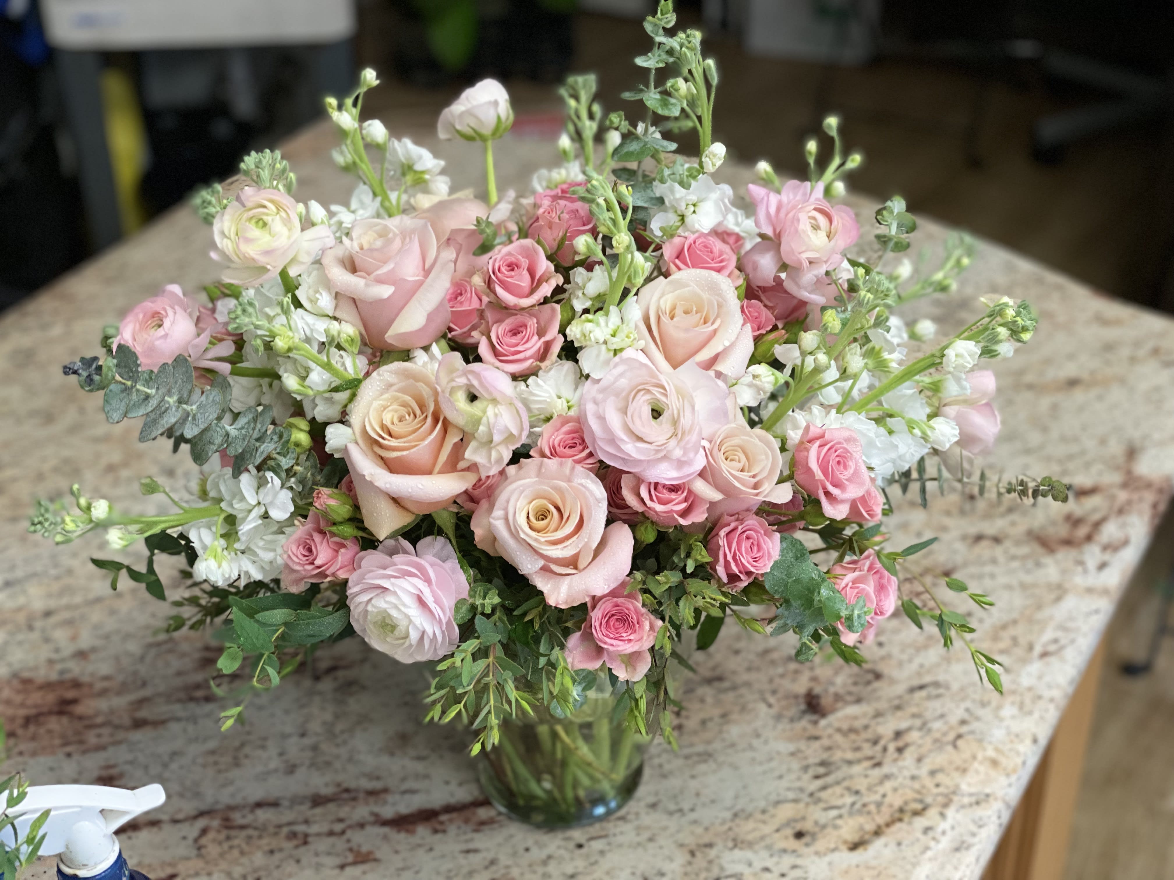 Sweet Thoughts - A collection of mixed soft pinks and white, filled with spray roses, rose, stock, ranunculus and mix eucalyptus.   Because we like to use unique and different blooms every week, we advise our customers to order 24-48 hours in advance of their scheduled delivery to ensure that we are able to have similar flowers and colors in the shop for their order.  $200 (premium) as shown