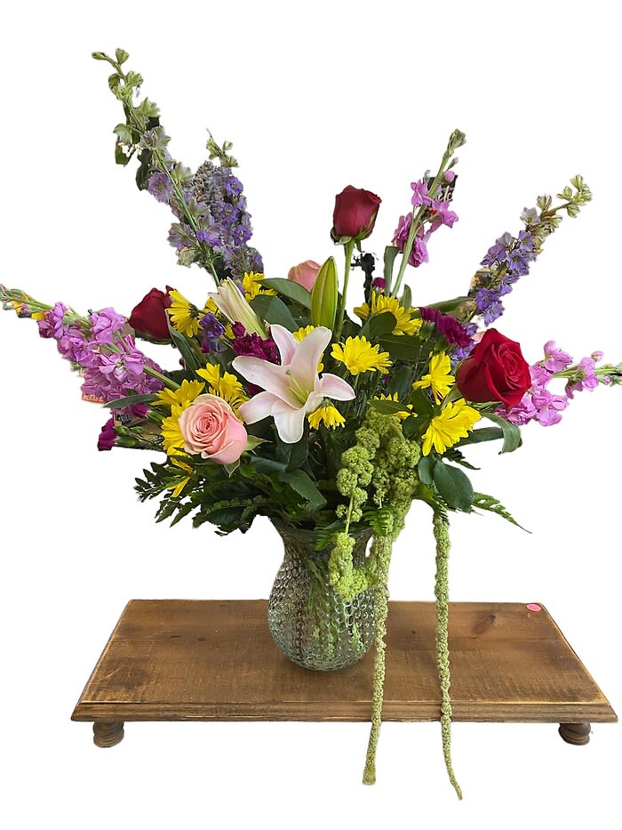 Love You More! - Say Love you more with this beautiful mixed vase. Shown with larkspur, stock, roses, lillies, mini carnations, daisies and hanging amaranthus. (depending on availability)