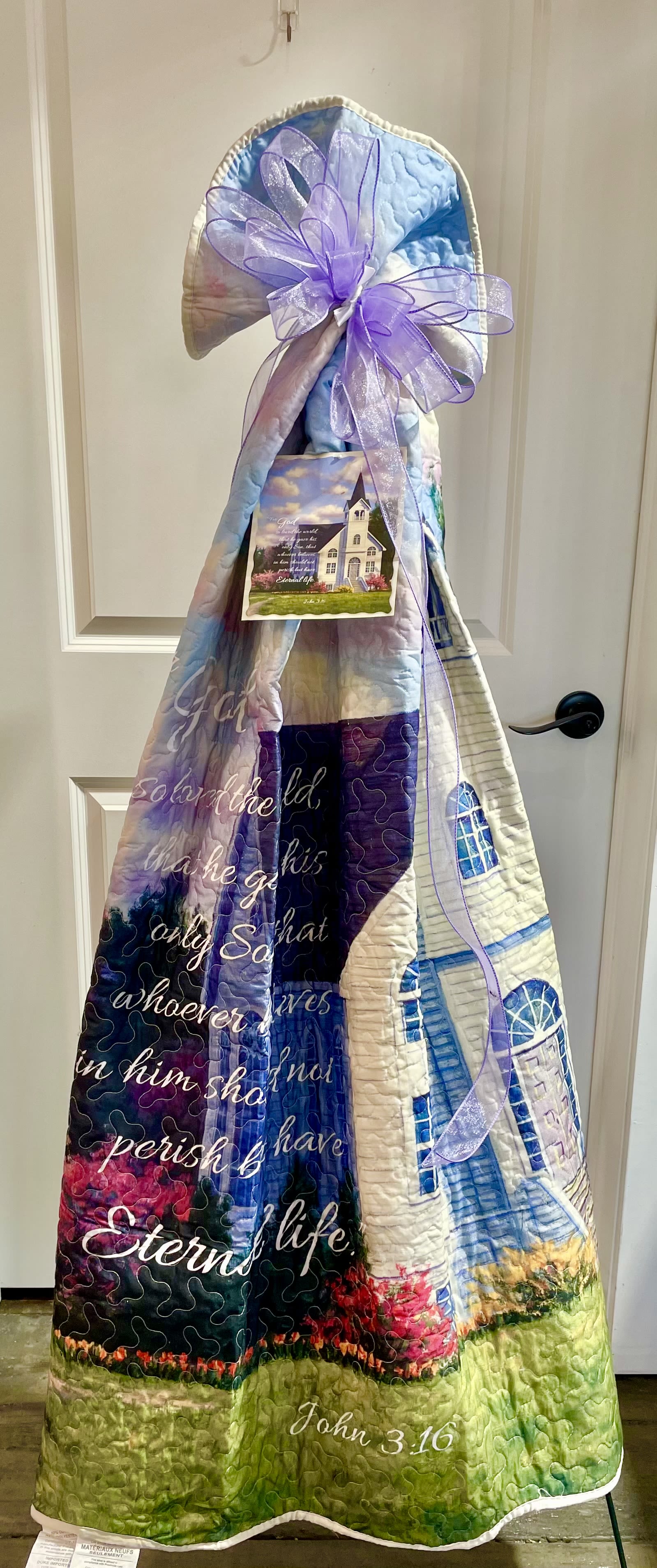 Sympathy Keepsake Quilt - These sympathy keepsake quilts come in a variety of styles and colors with poems, scriptures or hymns. Call the shop for availability.  If you choose to send a keepsake quilt and do not call us with a selection, one will be chosen for you. These are beautiful keepsakes that come on a stand but can easily be taken off and kept by the family.