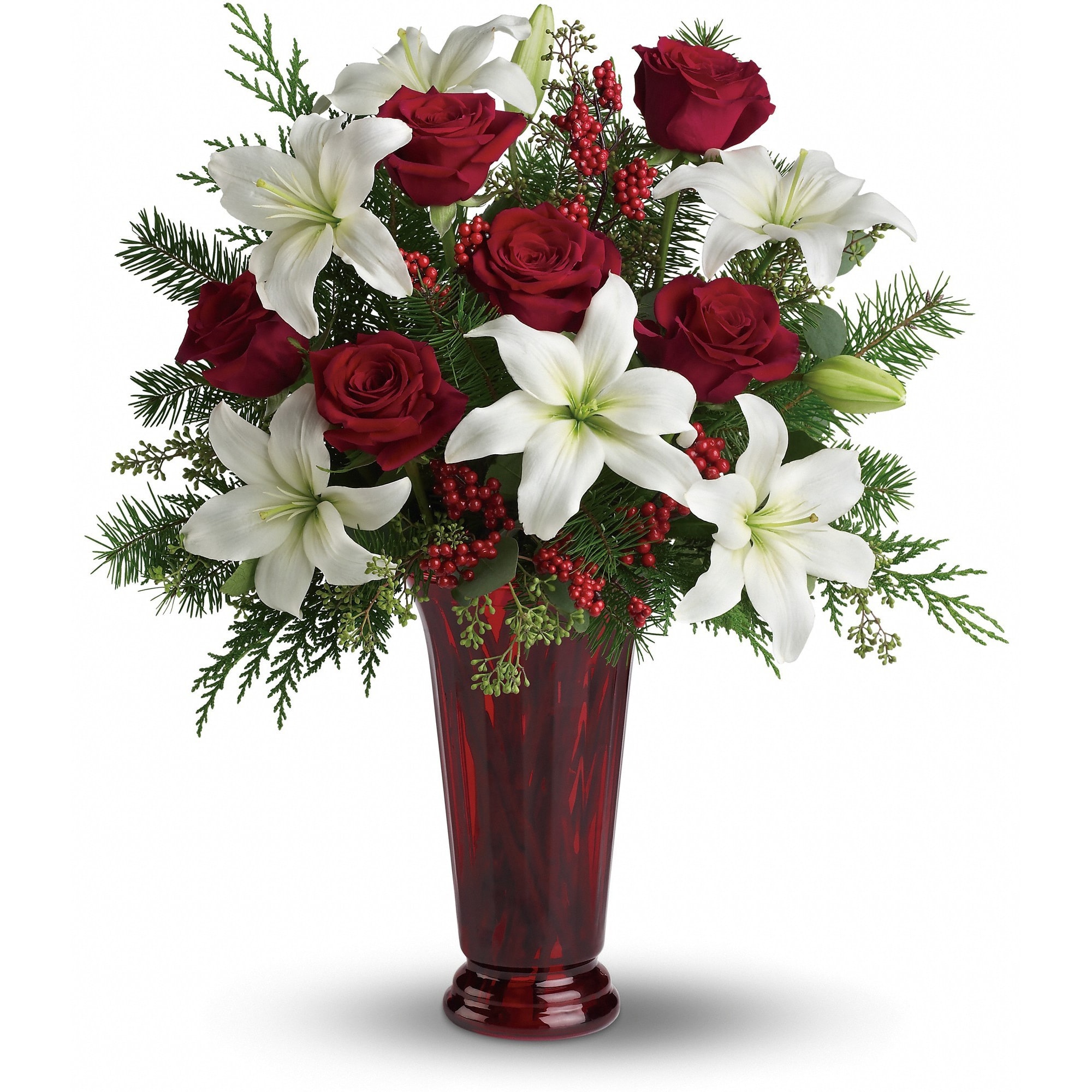 Holiday Magic  - With beautiful red roses and brilliant white lilies delivered in a dramatic tall ruby vase, this dazzling holiday arrangement casts an enchanting spell. A step up from the traditional, its effect is nothing less than magical.    White asiatic lilies, red roses, fir, cedar and eucalyptus create the perfect holiday bouquet, especially when delivered in a stunning ruby red roman column vase.    Approximately 20" W x 22 1/2" H    Orientation: One-Sided        As Shown : T117-1A      Deluxe : T117-1B      Premium : T117-1C    