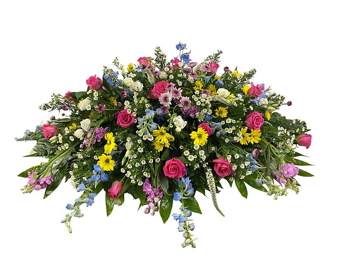 Sweet Memories Garden Casket Spray - Sweet memories garden casket spray includes roses, delphenium, stock, monte casino, daisies and other flowers.  This spray is arranged to fit the bottom half of the casket and flow slightly over the edges.
