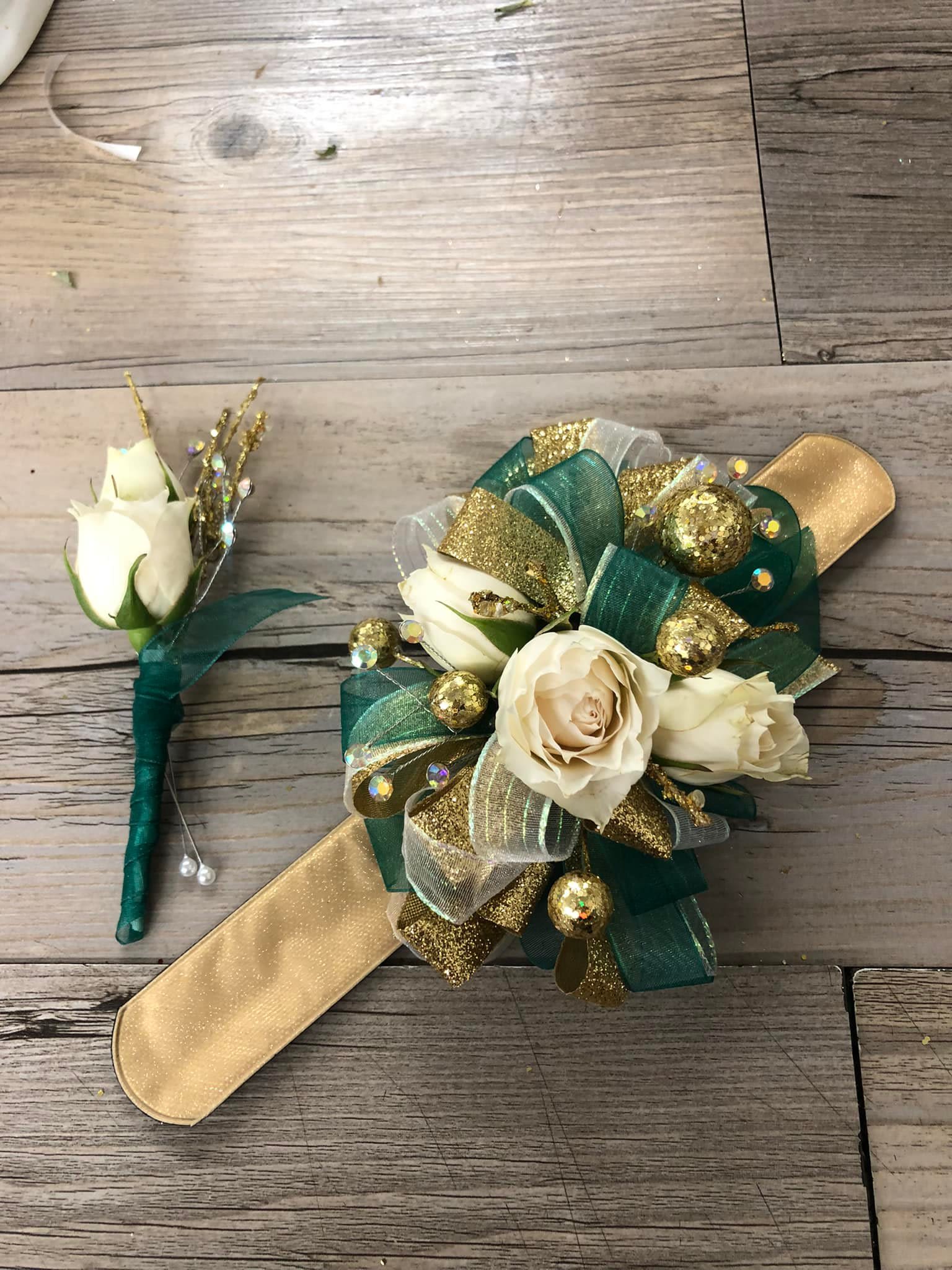 Golden Hour Wristlet and Boutonniere  - Wrist corsage and boutonniere in dark green and gold, with cream colored spray roses and gold glitter accents.