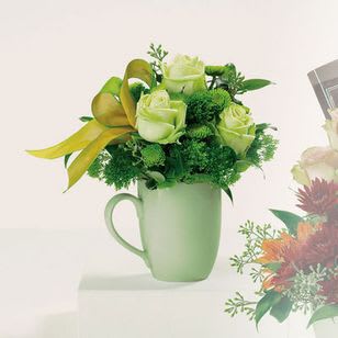 Morning Mist - Savor the pleasure of a dew-kissed dawn with this mug full of 'Green Tea' roses, button pompons, Italian ruscus and seeded eucalyptus