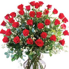 Three Dozen Long Stem Red Roses - Three dozen Red roses vased with greenery and filler. 