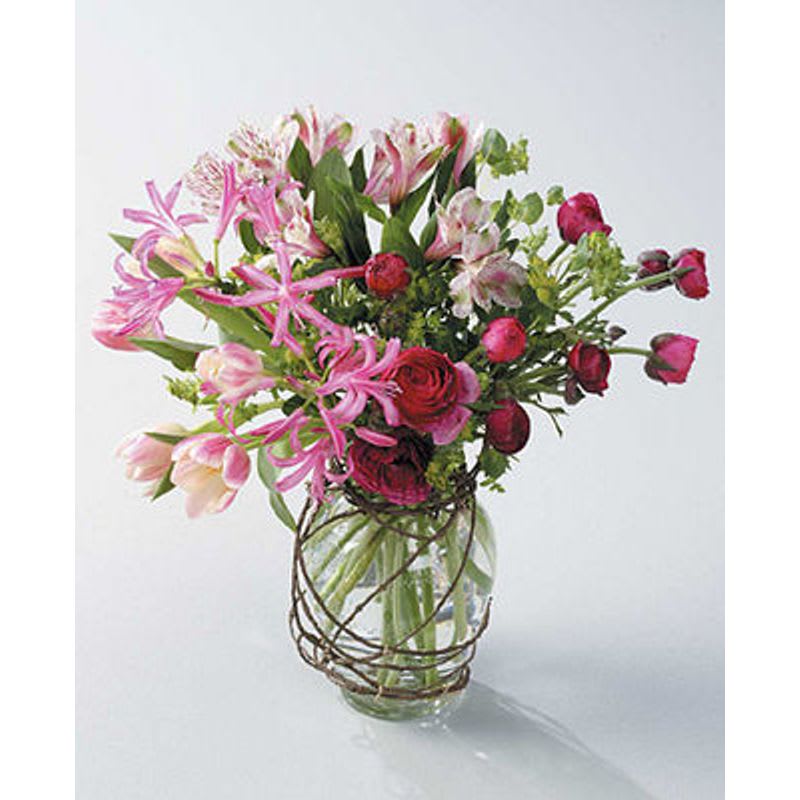 Spring Vase - A glass vase with pink, white and red lilies, alstromeria, roses and tulips.For the home or the service.