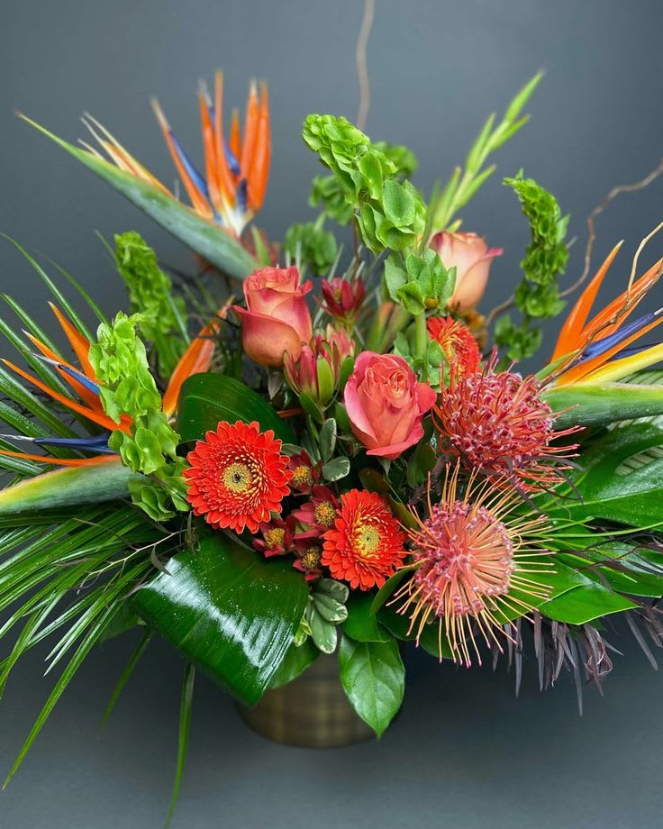 Tequila Sunrises - This arrangement with remind you of beautiful Mexican sunrises with this tropical mix. 