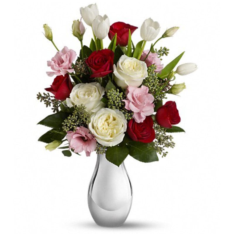 Love Forever Bouquet with Red Roses [T400-1A] - Tickle her heart with this flirtatious mix of romantic roses, lisianthus and tulips. This bouquet is arranged in our elegant Silver Reflections vase. It's a vase she's sure to hold on to - and it'll always remind her of you.  This feminine bouquet features large white and red roses, delicate pink lisianthus, elegant white tulips and seeded eucalyptus and comes delivered in our exclusive Silver Reflections vase, a metalized ceramic vase with a light pink tone.  THIS ITEM WILL NOT BE AVAILABLE FEB 10TH-15TH.  SIMILAR ARRANGEMENTS FOR THESE DATES CAN BE FOUND IN THE VALENTINE’S 2020 SECTION.