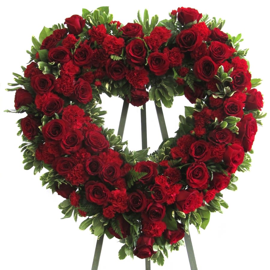 Majestic Heart Spray - A classic standing spray designed with roses and carnations expresses pure love and tenderness. Our "Majestic Heart" looks elegantly beautiful at your beloved's funeral. 