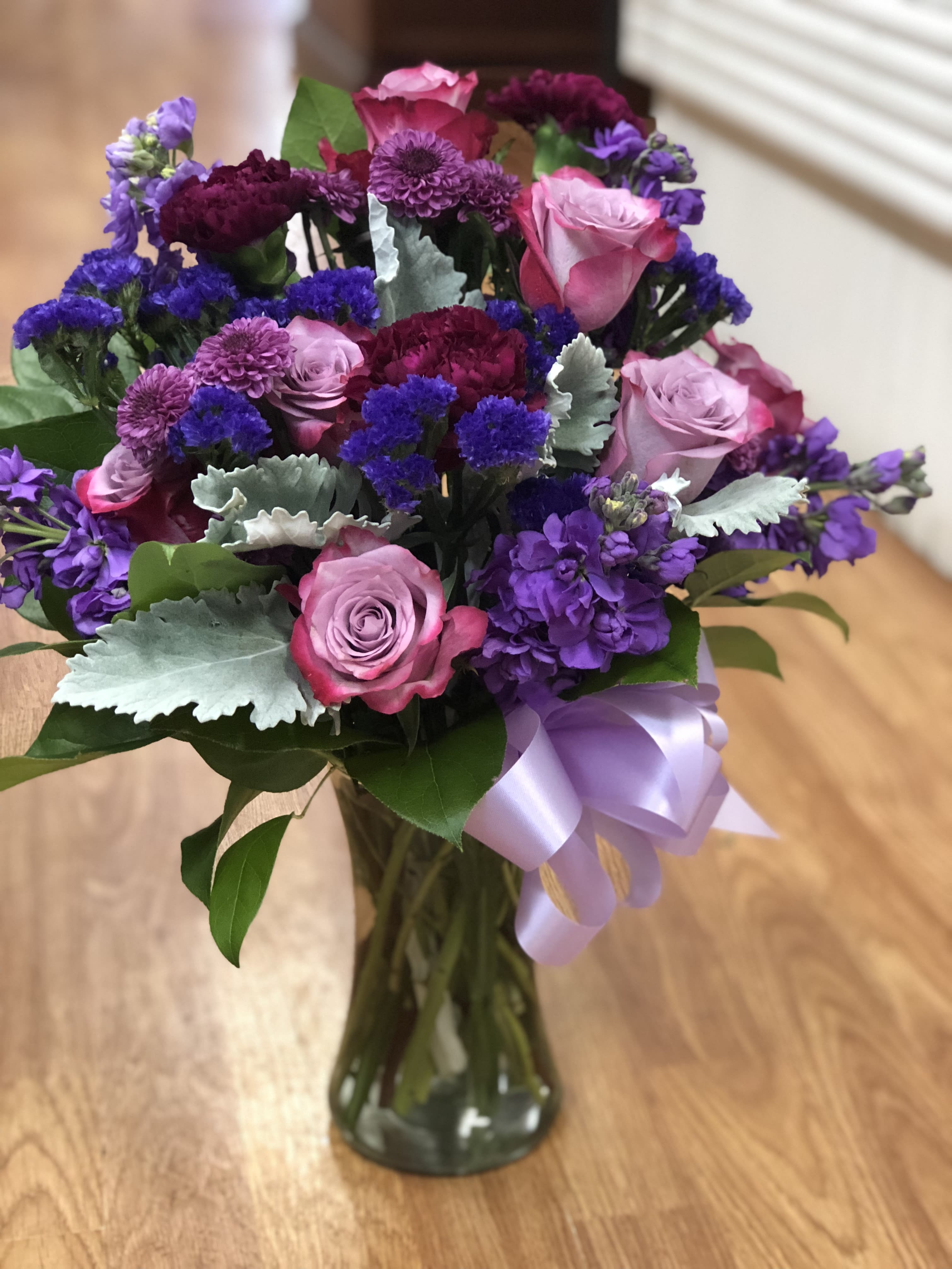 Petaluma bqt - fresh flowers include  purple roses, purple satic flowers, ,stock and carnation purple