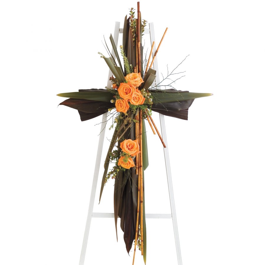 Beautiful Memories Spray - Our "Beautfiul Memories" funeral cross made out of ti leaves is simply embellished with six roses, coffee beans, and bamboo sticks. A lovely representation of your timeless memories, choose this beautiful funeral cross to accompany your service.  