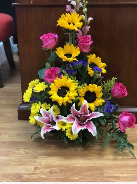 Teresa's bouquet - sunflowers hot pink roses pink snapdragon and stargazer lily's with a mixture of green's