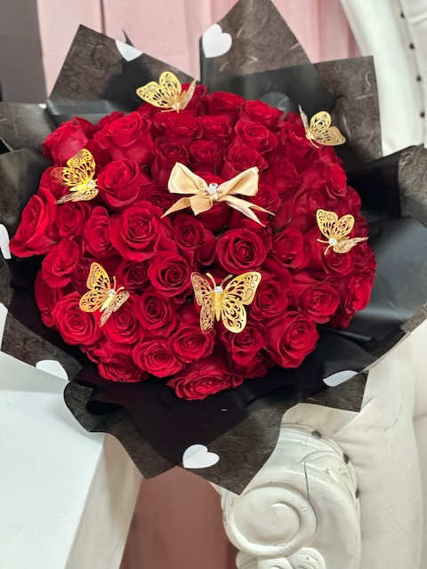 red roses with butterflies Buchon - 100  red roses with butterflies. amount of roses vary depending price point chosen