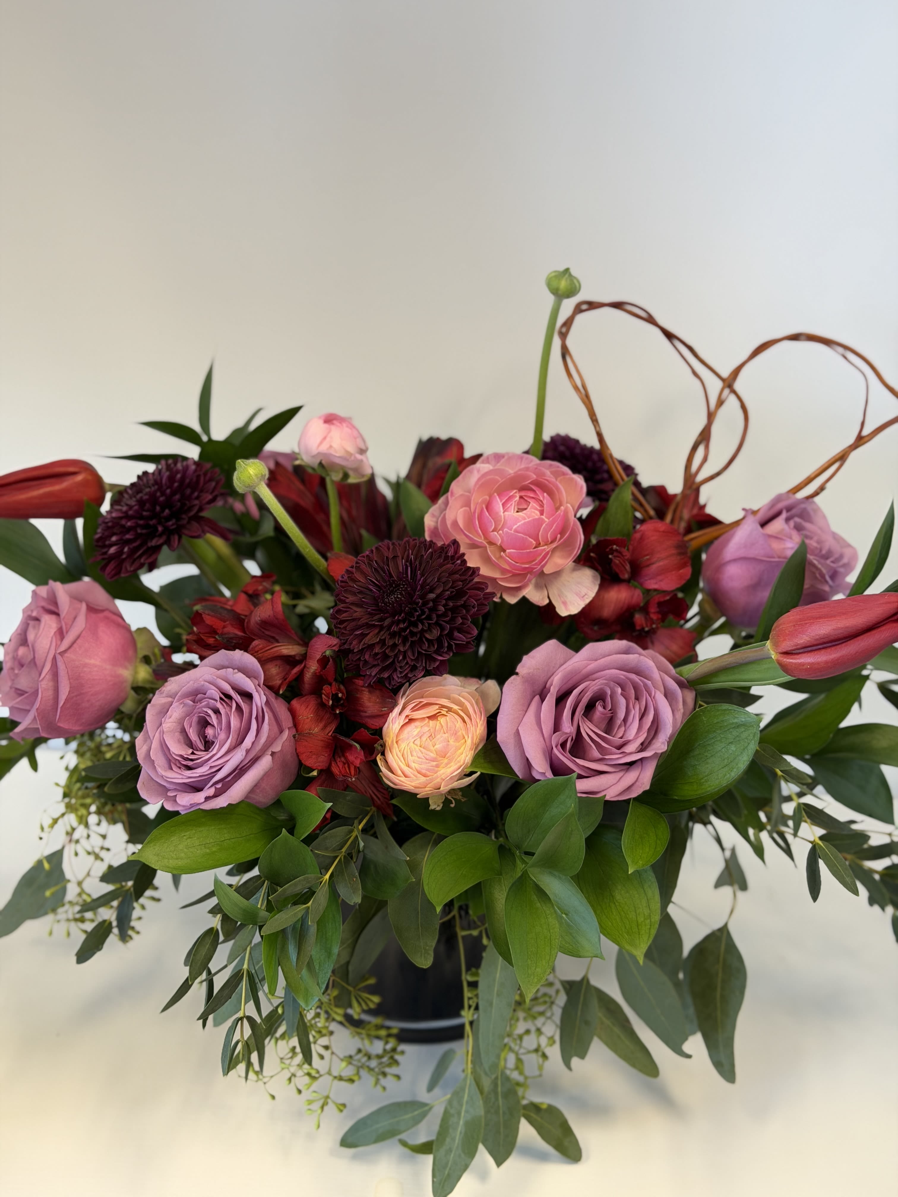Velvet Crush - Beautiful arrangement with lavender roses, red alstroemeria, moody mums and blushing ranunculus. 