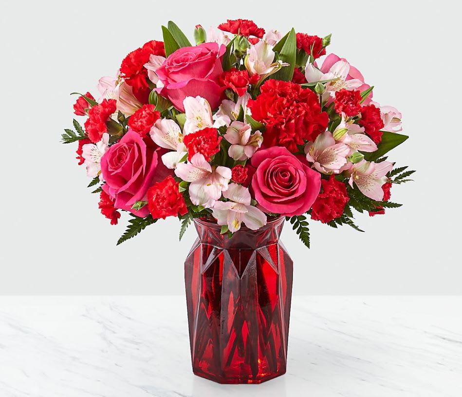 Adore You - Fall in love at first sight with our Adore You™ Bouquet. Beautifully designed with hot pink roses, red carnations and pink alstroemeria, this flower arrangement is sure to have them blushing all Valentine's Day long! GOOD bouquet is approx. 14"H x 13"W. BETTER bouquet is approx. 15"H x 13"W. BEST bouquet is approx. 16"H x 14"W