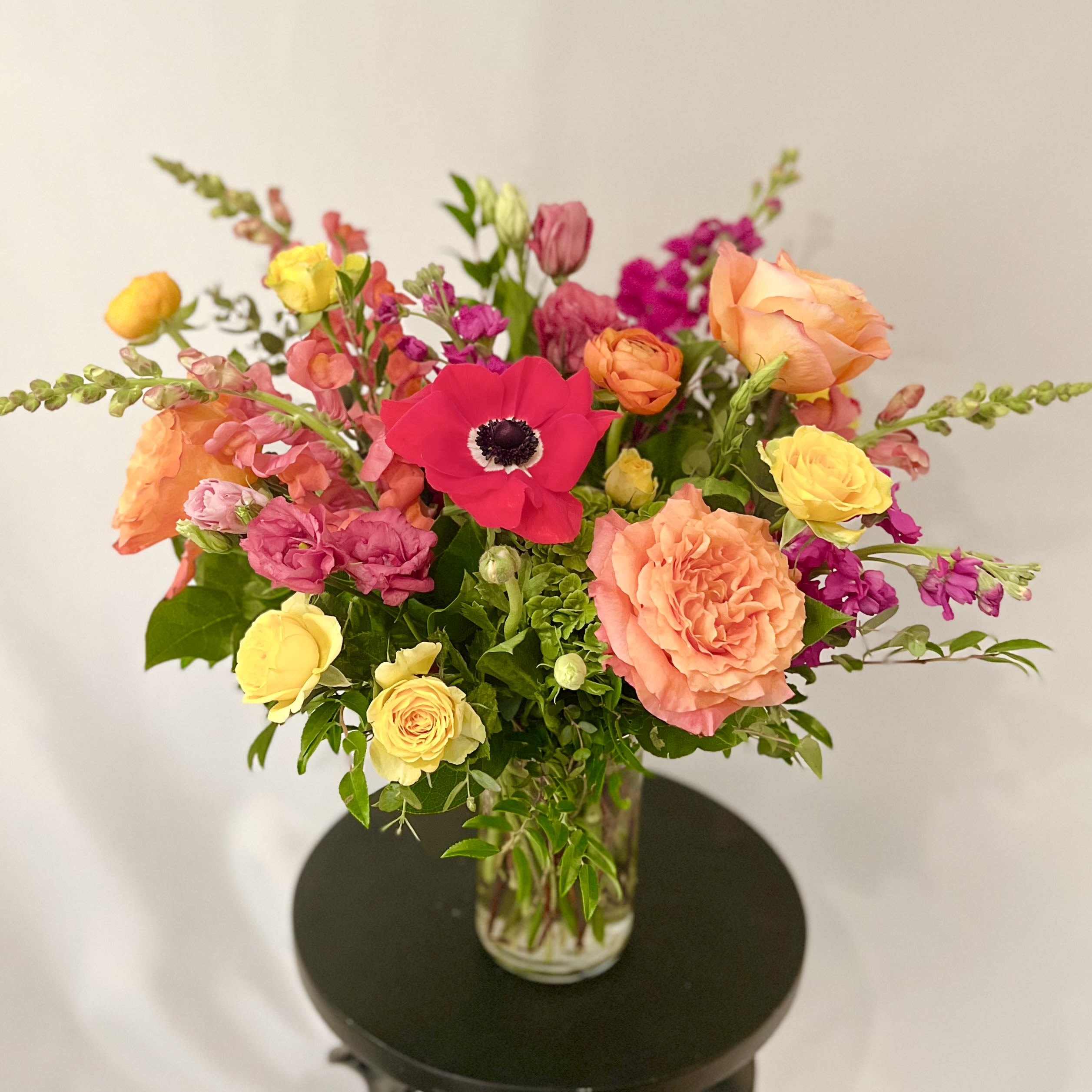 Color Pop - English Garden - Luxury Collection - An exquisite English Garden styled arrangement of our brightest colored blooms from our weekly Studio Theme.  Specific flower varieties and colors pictured are not guaranteed. Each arrangement is delivered with a hand written card.