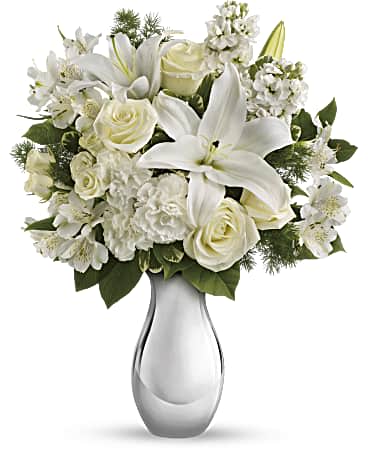 I’m loving memories  - A dreamy bouquet of white sympathy flowers is a comforting reminder of your love. The lush arrangement of soft colors is delivered in a majestic, tall silver glass vase. This gorgeous bouquet overflows with white crème roses, white spray roses, white oriental lilies, white stock, spiral eucalyptus, salal and Italian ruscus in a classic glass vase. Orientation: One-Sided 