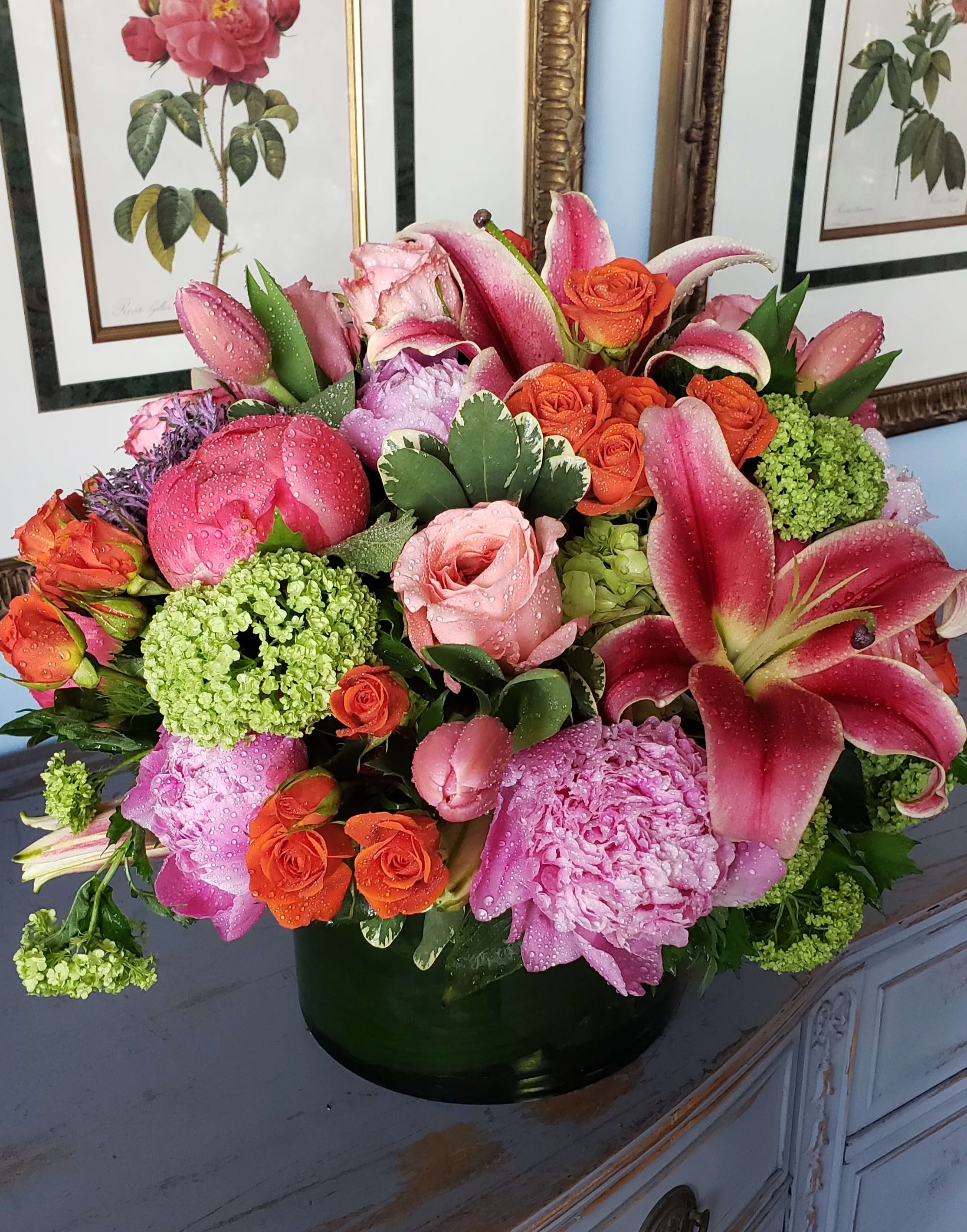 Vivid Euphoria  - Vivid Euphoria is an elegant arrangement filled with the brightest summer blooms, including coral peonies, oriental lilies, pink garden roses, viburnum, green hydrangeas, tulips, and spray roses. This stunning mix of vivid colors and textures will bring warmth and joy to any space, making it the perfect centerpiece for any occasion.  Please note: Floral variety and vase may vary depending on availability, ensuring each arrangement is fresh and unique.  Freshness Guarantee: At Belden's Florist, we stand behind the quality of our products. Our flowers are guaranteed to remain fresh and beautiful for 3–5 days after delivery. While cut flowers may naturally start to wilt beyond this timeframe, we ensure that you receive the freshest blooms possible, carefully selected and expertly arranged to bring joy and elegance to your space. To help your flowers stay fresher longer, we recommend adding fresh water to the vase regularly. Just like you, flowers need hydration to thrive, and refreshing the water allows them to drink up and continue to dazzle you with their beauty.