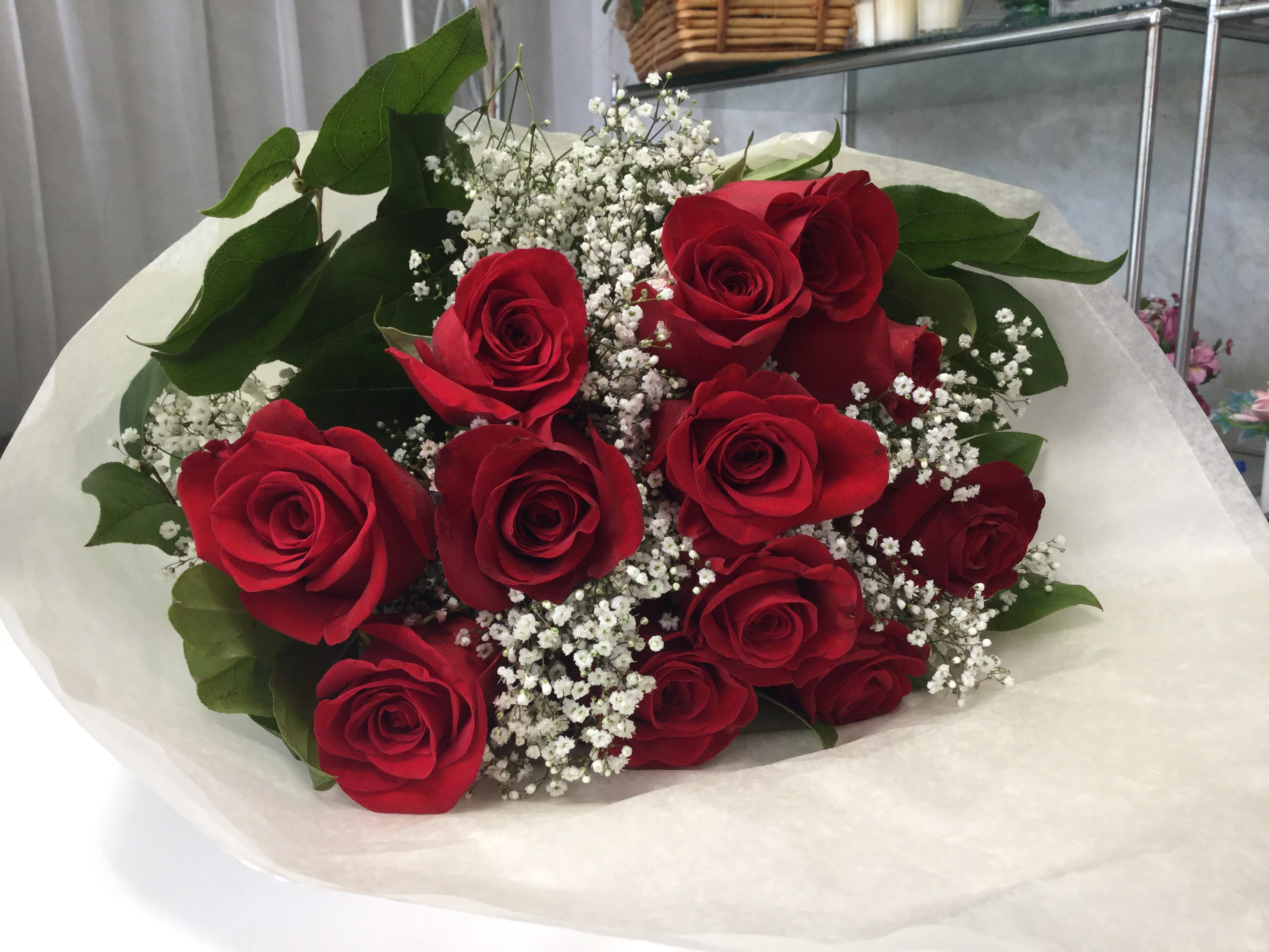 A Dozen Reasons to Love Rose Bouquet - Send this one dozen red rose bouquet for every special occasion. From Birthday to Valentine's Day to even Just Because. Your special someone will be surprised, happy and full of love. Please place in vase with fresh water the same day. Please change water daily. Includes baby breath and a beautifully elegant wrap.