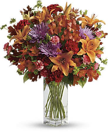  Fall Brights Bouquet - Ring in the season with this fresh, colorful arrangement of lilies and alstroemeria. Hand-delivered in our beautifully crafted vase, it's an easy way to brighten anyone's day! This lovely bouquet includes orange asiatic lilies, dark orange alstroemeria, red carnations, orange miniature carnations, lavender disbud chrysanthemums, bupleurum, lemon leaf and oak leaves. Delivered in Teleflora's exclusive clear Bunch vase.