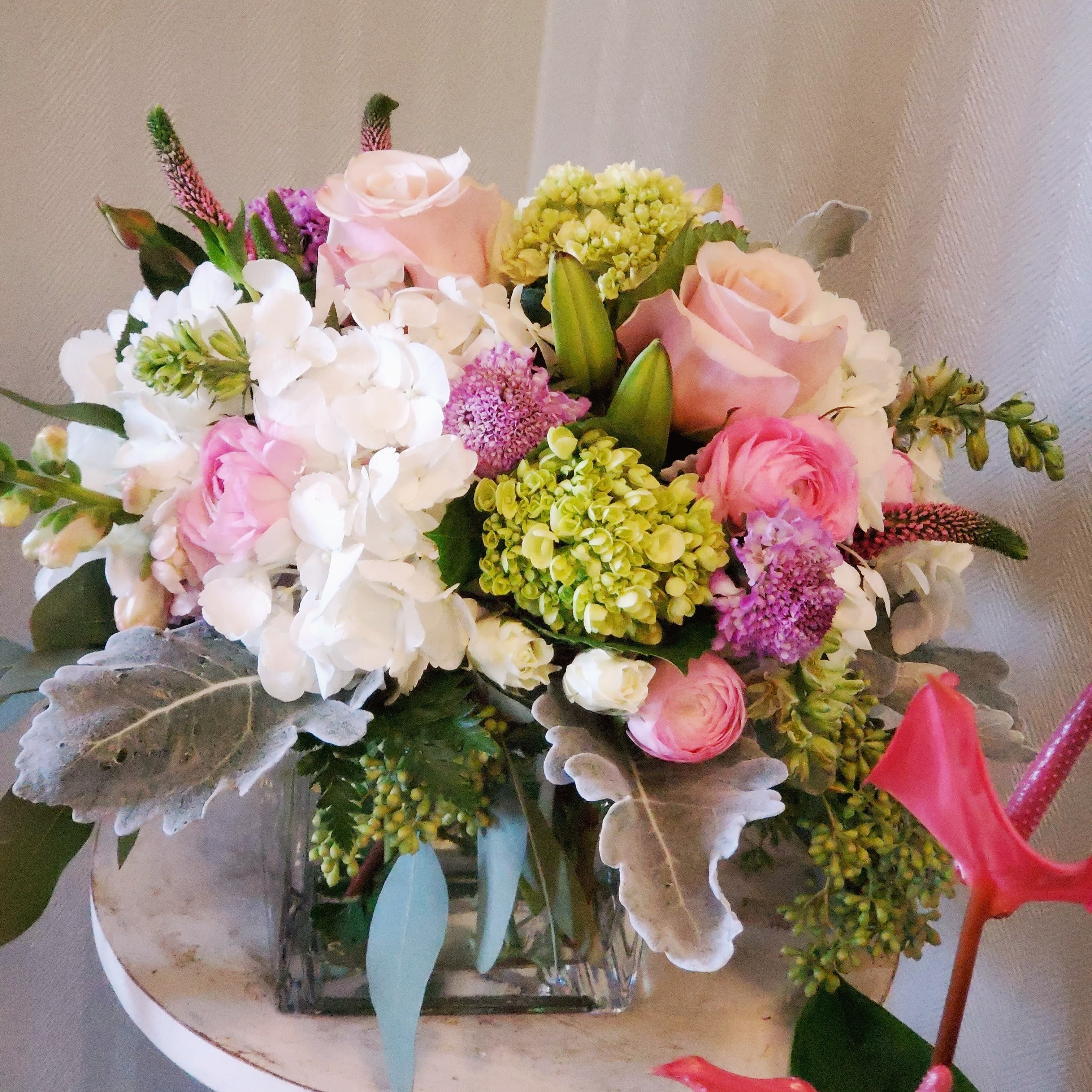 Dusty Love   - Mini hydrangeas,  roses,  football mums , carnations , Veronica 