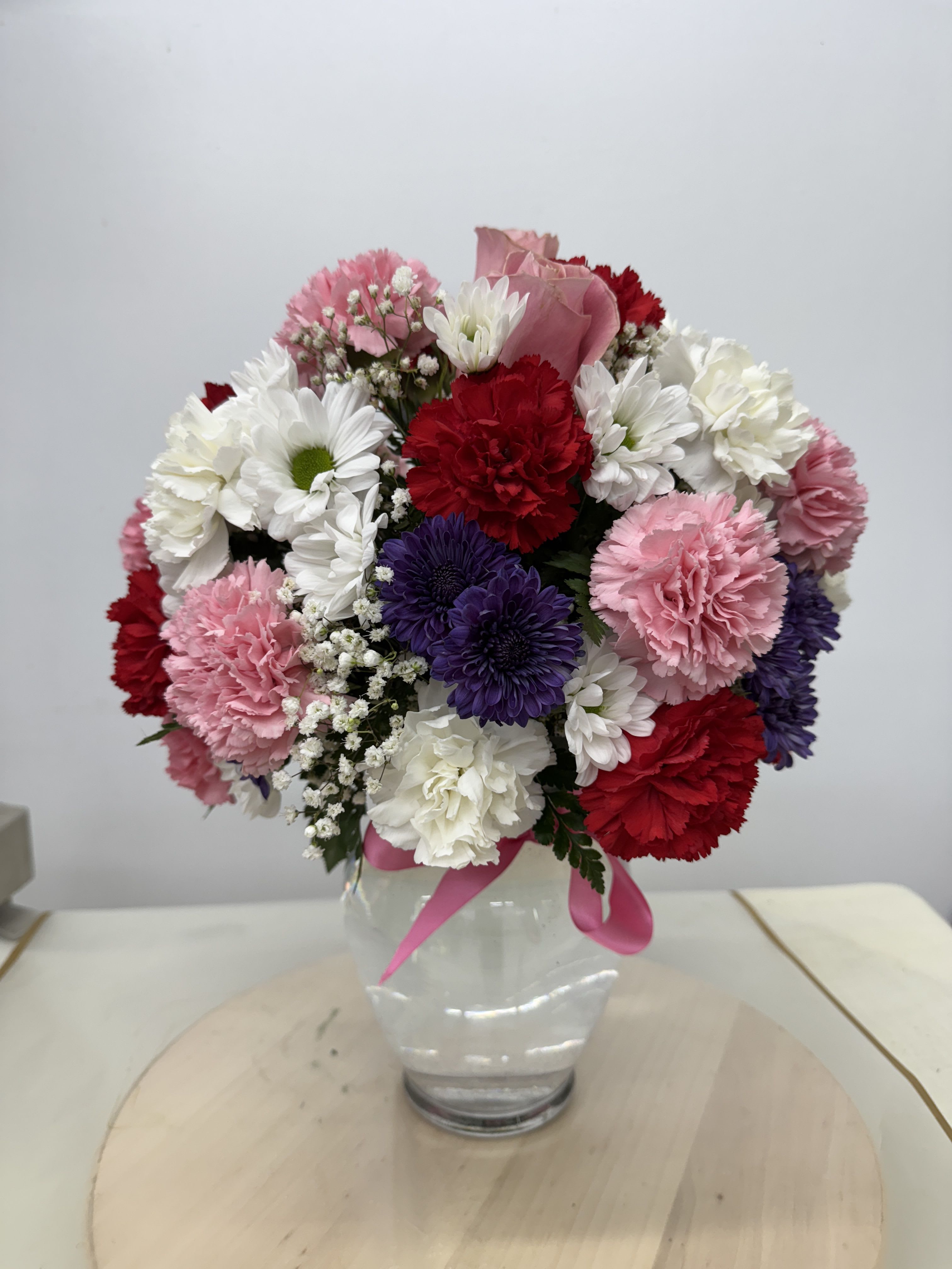 Cotton Candy (with pink Roses) - Soft and divinely delicate, this perfect pastel bouquet is pretty as can be. Delivered in a classic ginger jar, the graceful arrangement of   carnations, Roses Mom's.   welcome surprise on any occasion. 