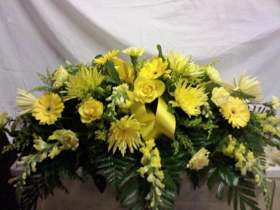 Yellow Casket Spray - Celebrate the life of a loved one with a spray of all yellow flowers