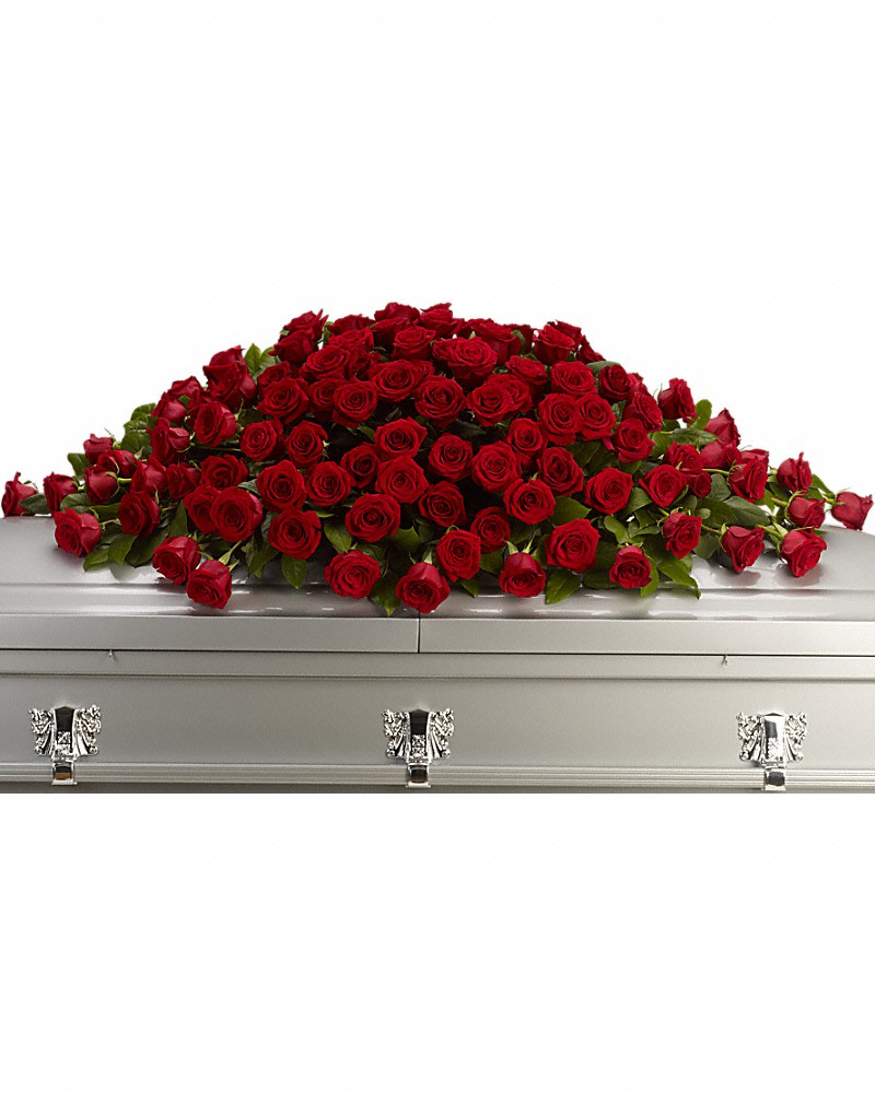 Greatest Love Casket Spray - A loving embrace of rich regal roses in an all-red spray to adorn the casket. A full spray of crimson roses alternating large with slightly smaller.