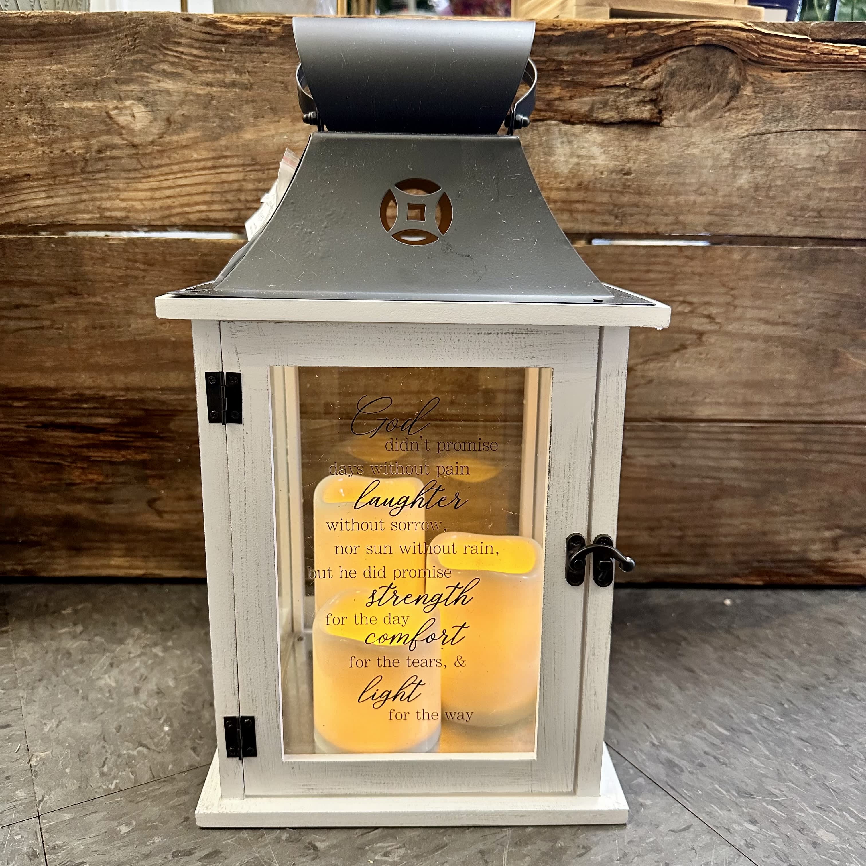 Trio Candle Lantern  - Lantern reads; "God didn't promise days without pain laughter without sorrow, nor sun without rain, but he did promise strength for the day comfort for the tears, &amp; light for the way"  Stands roughly 16" tall  **All lanterns come included with batteries**