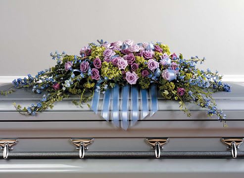 Lavender and blue tribute casket spray  - Casket spray of lavender, blues and green  flowers. 