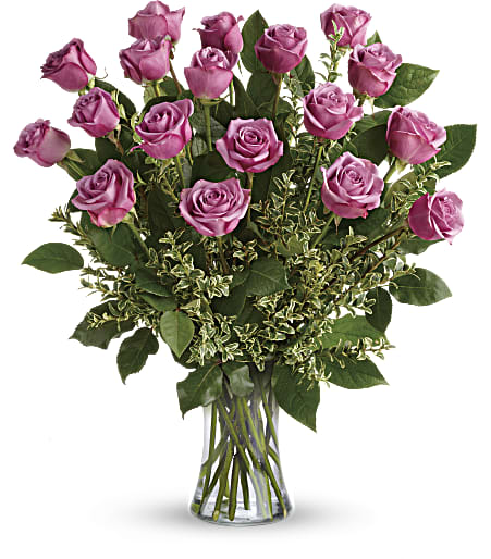  Dozen Lavender Roses (DL) - Experience the enchanting allure of our luxurious 12 long stem purple roses arrangement, exquisitely designed to captivate and impress.