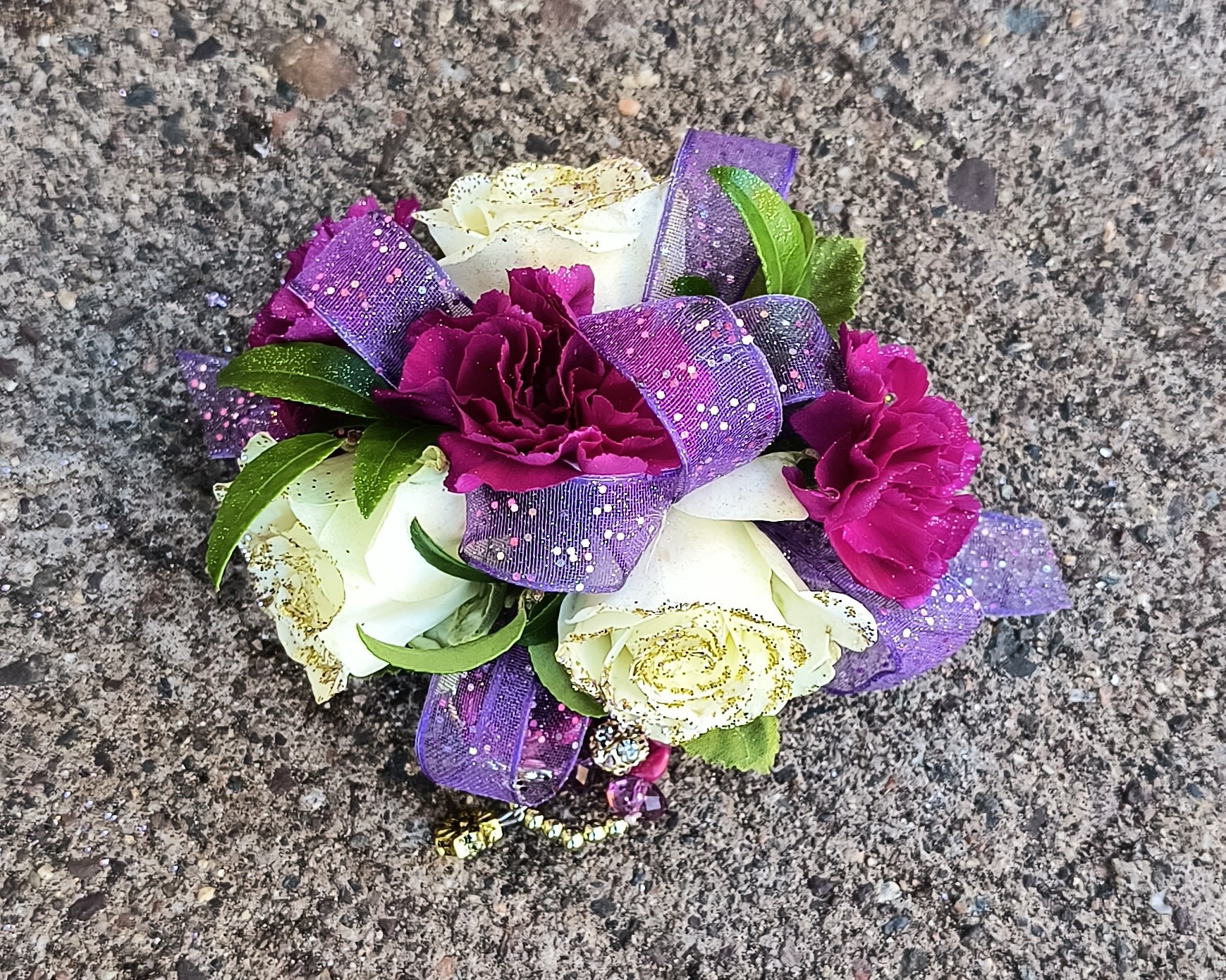 Famous Wrist Corsage - You'll feel like your walking the red carpet wearing this corsage. Comes with a fancy beaded wristlet.