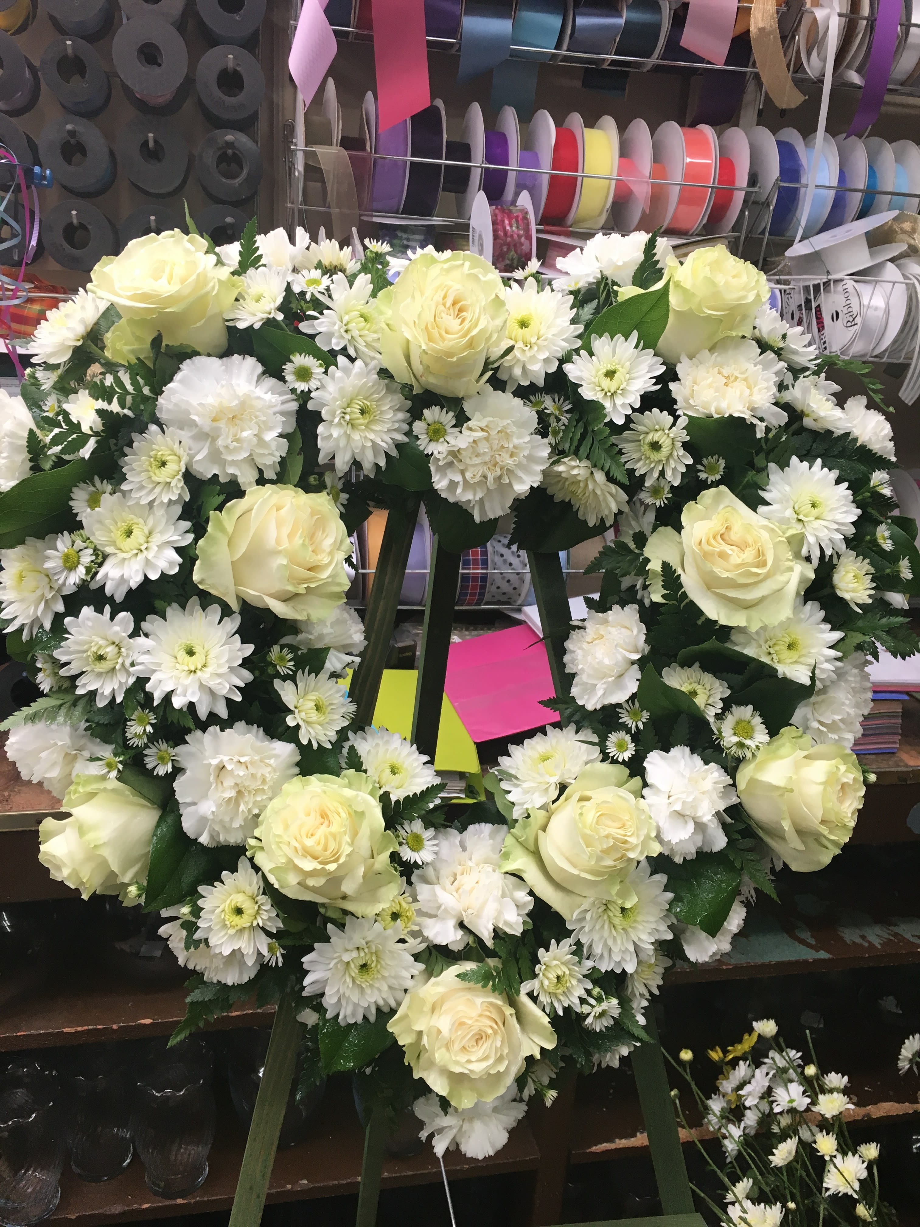 PURE HEART - A HEART OF MEMORIES FOR YOUR LOVED ONE. WHITE ROSES.WHITE CARNATIONS, AND WHITE CUSHION MUMS