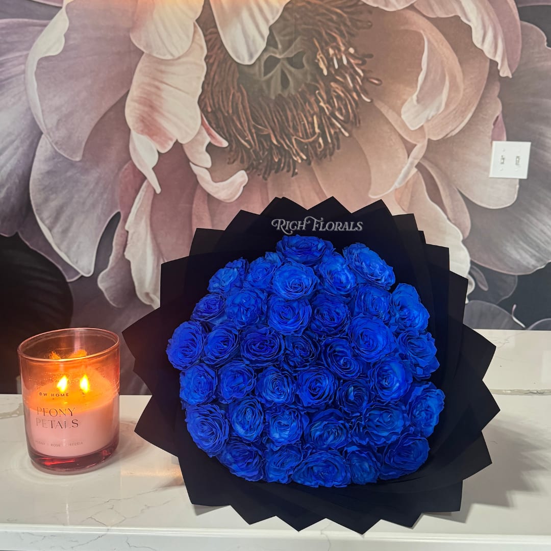Blue Rose Bouquet - Make a scene in the best way possible with this rare, head-turning bouquet. Available in 25, 50, or 75 count, because impact comes in your size.  Fully customizable. Add baby’s breath, rhinestones, a name, a number, or letter.