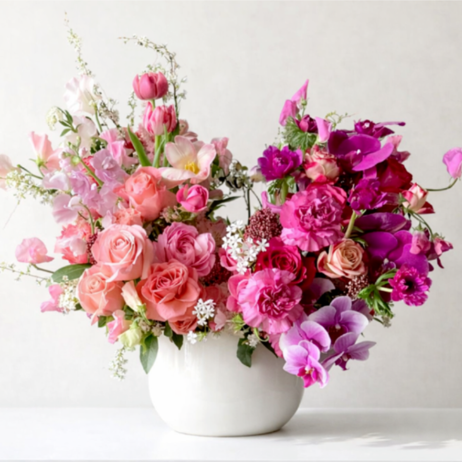 Maison de Blush - Gorgeous and elegant, sweetly romantic. Maison de Blush is a gathering of blush pinks and vibrant pink blooms featuring premium Garden roses, Japanese sweet pea, Dutch tulips, Italian Anemones, ranunculus and orchids. 