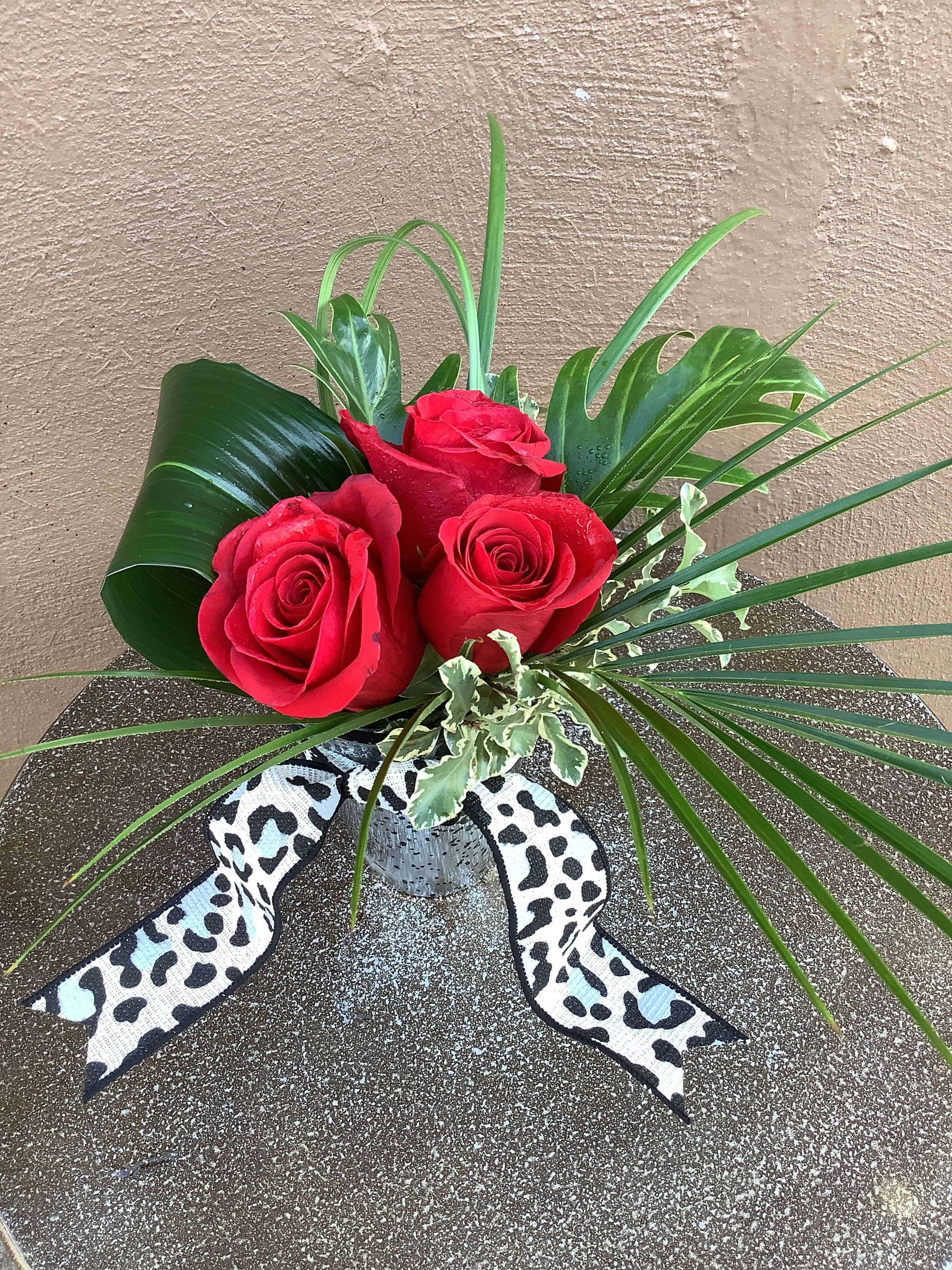 Little Wild Thing - Three red roses with tropical foliage. You can request other colors of roses.