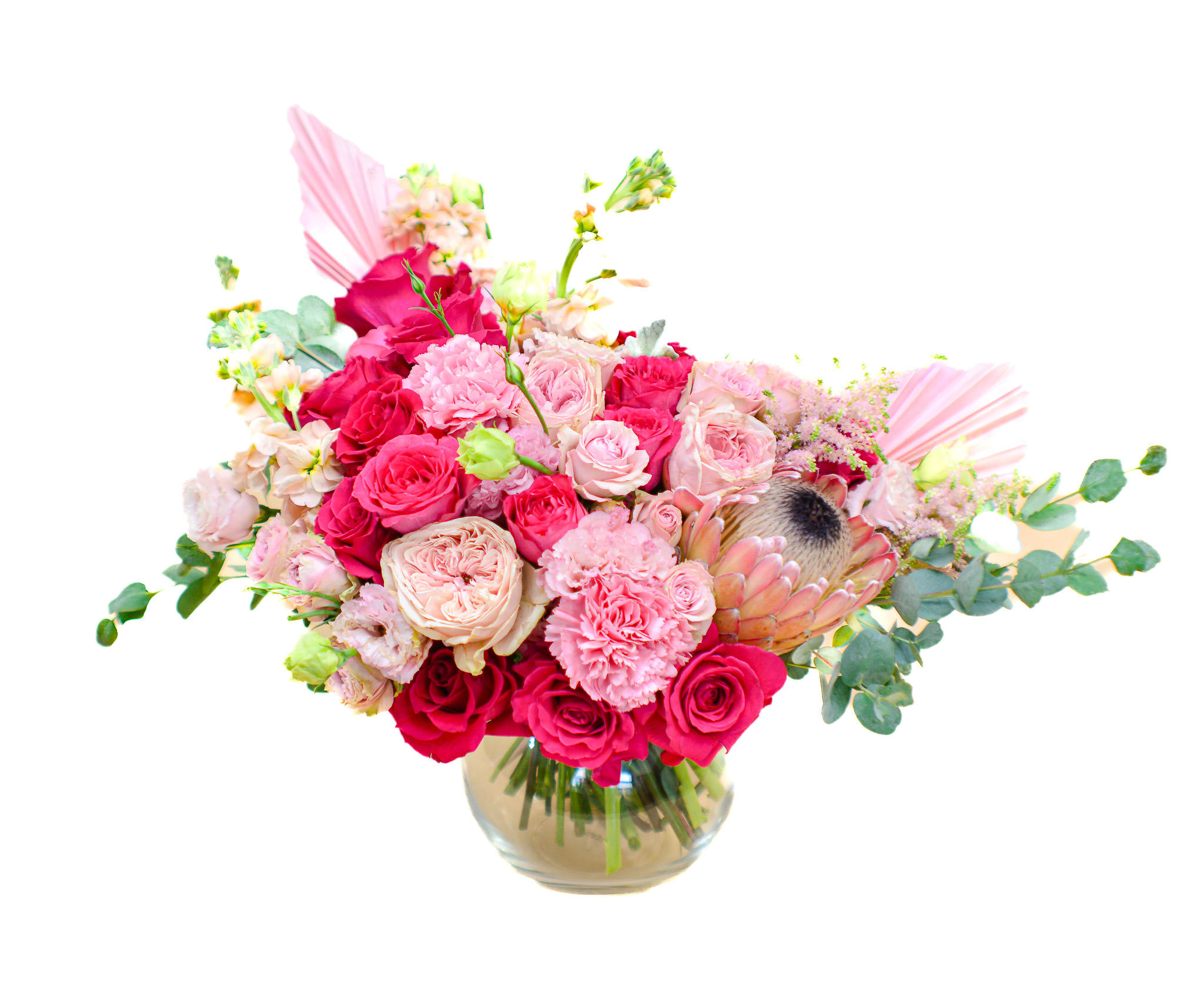 Luna - The bohemian spirit and undeniable beauty of Luna are hard to resist. The style of this bouquet is gorgeous and unique. Fuchsia and light pink shades fit perfectly together, we can feel the harmony between them. A sweet combination of roses, garden roses, mathiolla, lisianthus and protea, it’s the obvious choice for adding some sweetness and happiness to your space. Fuchsia flowers inspire confidence, assurance and maturity. Comes in a round vase bowl.