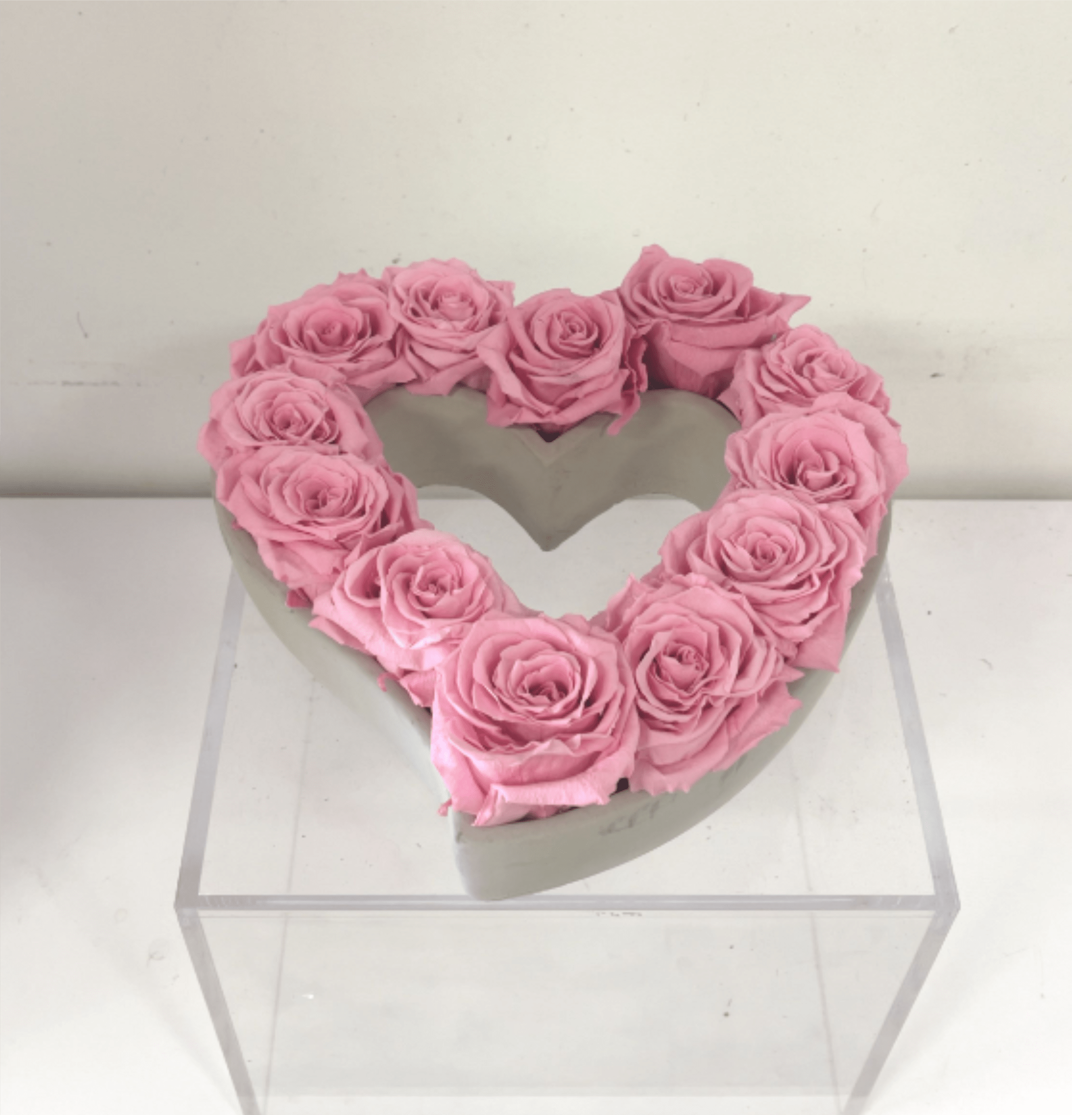 Pink Eternal Roses in Hear-Shaped Ceramic Vase - Our Eternal Roses are pink real roses, preserved at the height of their beauty to last far beyond a single moment. Each bloom symbolizes enduring love, passion, and devotion — a timeless expression of romance that never fades.  Designed for gifting, these roses require no water or maintenance while maintaining their velvety petals and natural form. An elegant alternative to fresh flowers, Eternal Roses are perfect for those who want their love story to last.  Perfect for: Valentine’s gifts · Romantic displays · Keepsake arrangements. Displayed in heart-shaped ceramic vase.  Our Eternal Roses are real preserved blooms, designed to maintain their beauty for up to several years under proper indoor conditions. As a natural product, subtle variations in texture and tone may occur over time, enhancing the unique character of each piece.  To preserve their beauty, keep roses indoors, away from moisture and direct sunlight. Do not water. Handle gently, petals are real and delicate. With proper care, your roses will maintain their elegance for years to come.