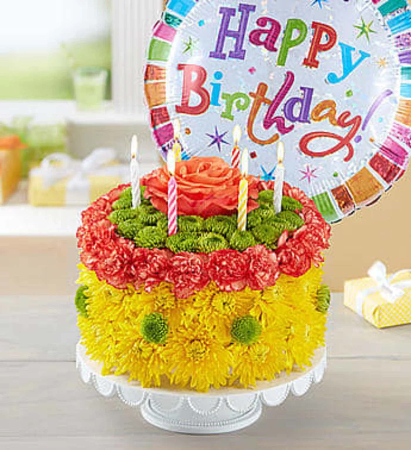 Birthday Wishes Flower Cake Yellow  - Our Birthday Wishes Flower Cake includes yellow chrysanthemums; green button poms; an orange rose; orange mini carnations!! Arrangement also includes birthday candles!! Balloon included !!