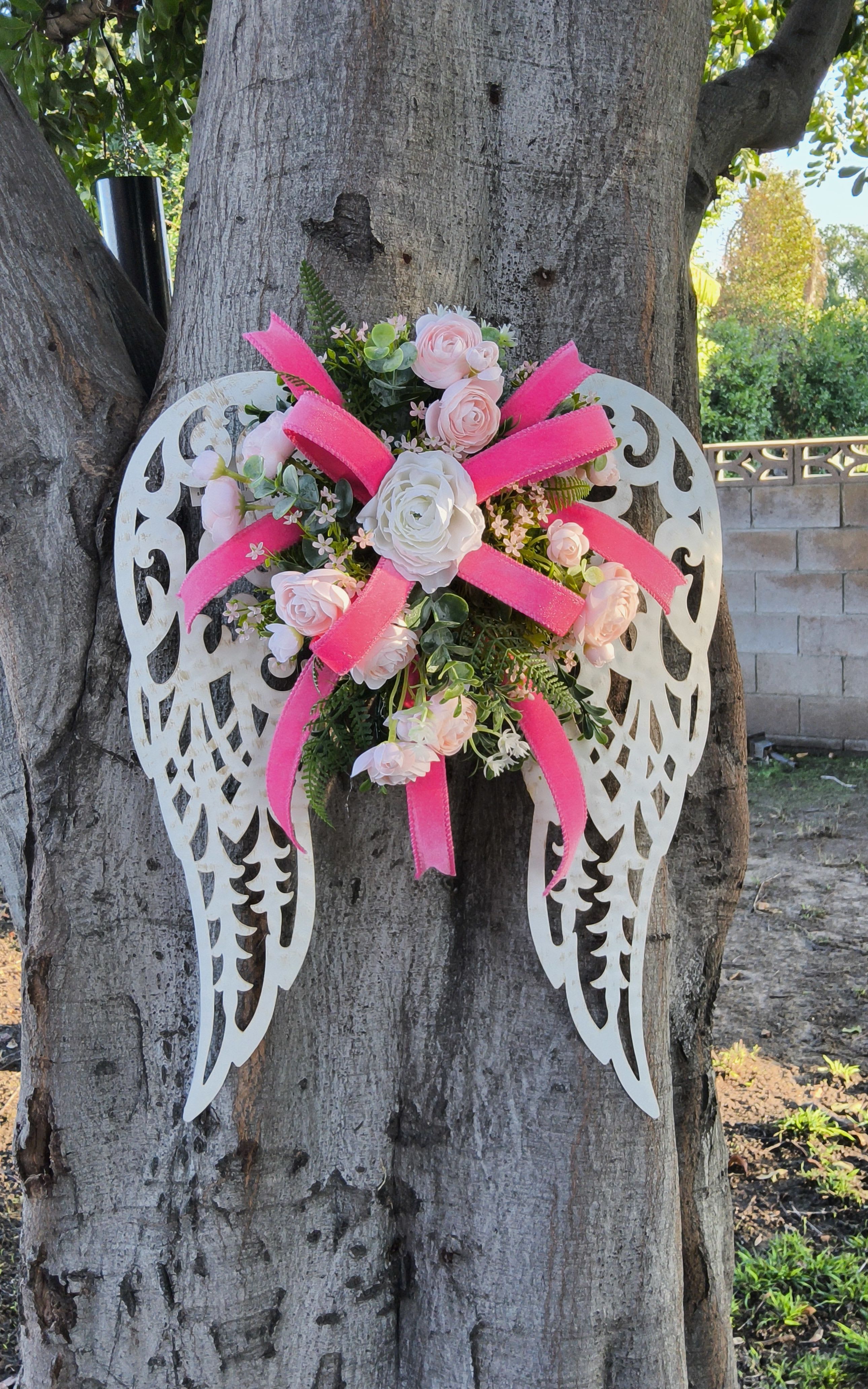 Wings of Grace - Metal wings designed with artificial floral and designer ribbon,  custom made for your loved one of your choice of color. Optional delivery or shipping 
