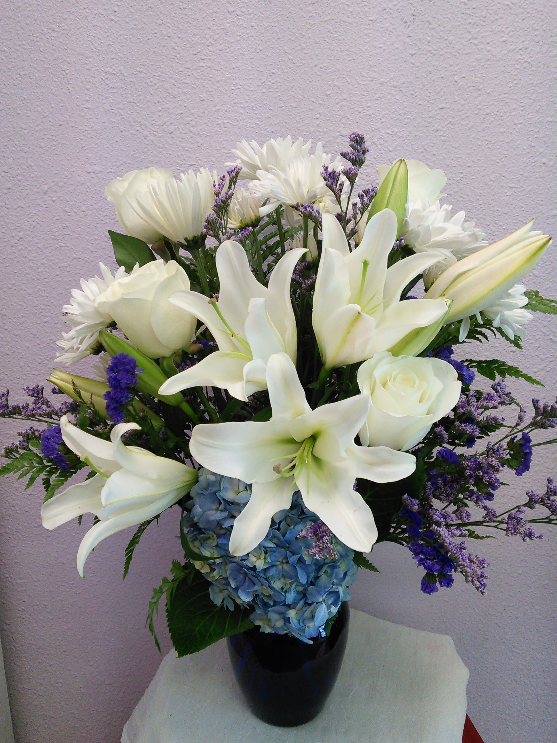 Beautiful Horizons By Forever Flowers - Touch their heart with this elegant, simple mixture of blue and white.