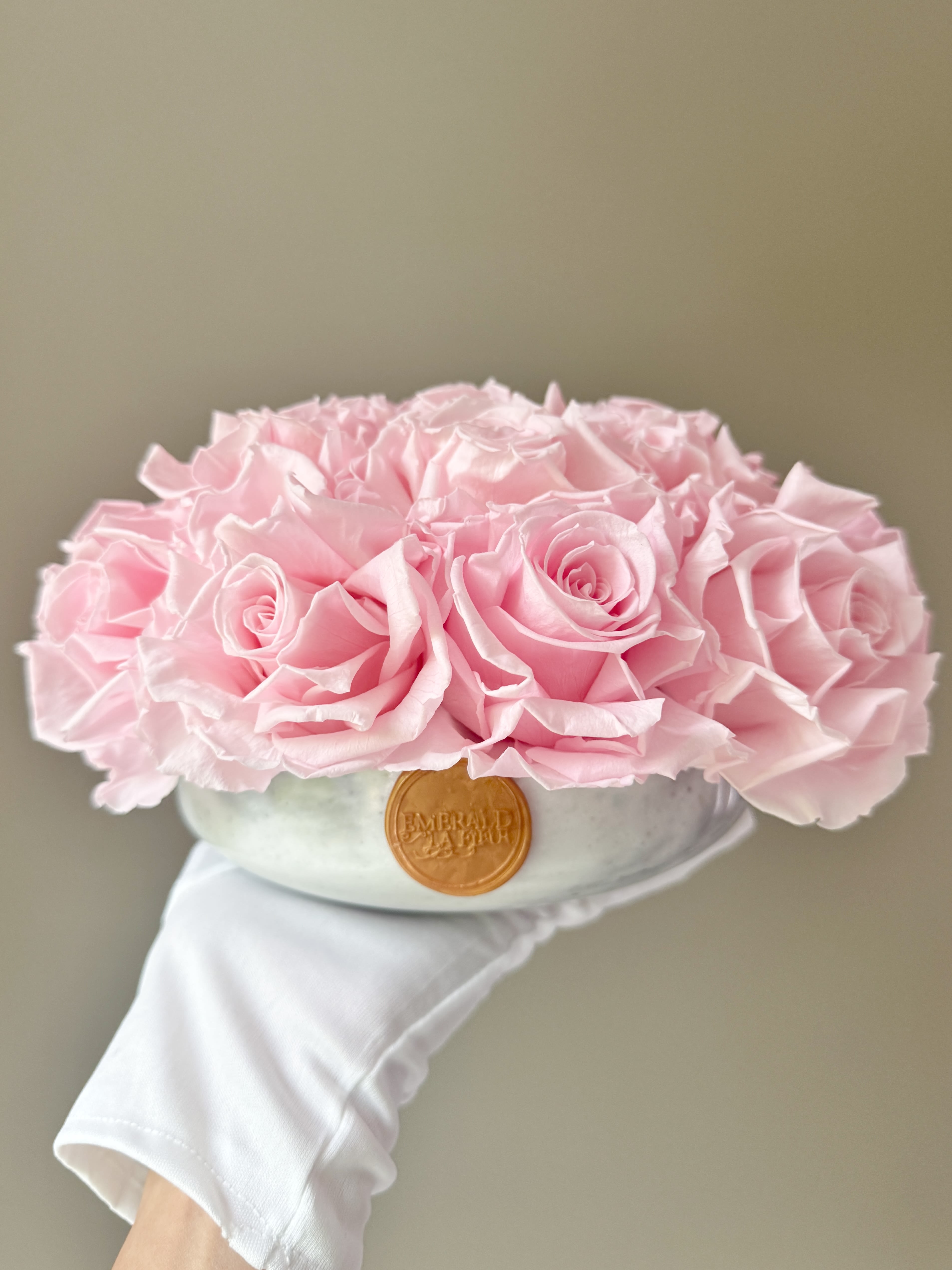 Eternelle Blush – Blanc Marble Luxe  - A timeless expression of elegance. Eternelle Blush – Blanc Marble Luxe features 16–18 preserved blush pink roses arranged in a premium white natural marble bowl. With its unique veining and lasting beauty, each piece is one-of-a-kind—designed to elevate interiors and endure for over a year with no maintenance. A stunning gift or personal treasure that speaks in soft, graceful tones.  Availability: Each Eternelle arrangement is handcrafted with the utmost care. If this arrangement is marked SOLD OUT, you can place an order to reserve yours, and we will provide the earliest available delivery date. Please allow approximately one week for restocking and fulfillment. Thank you for your patience as we create your exquisite arrangement.