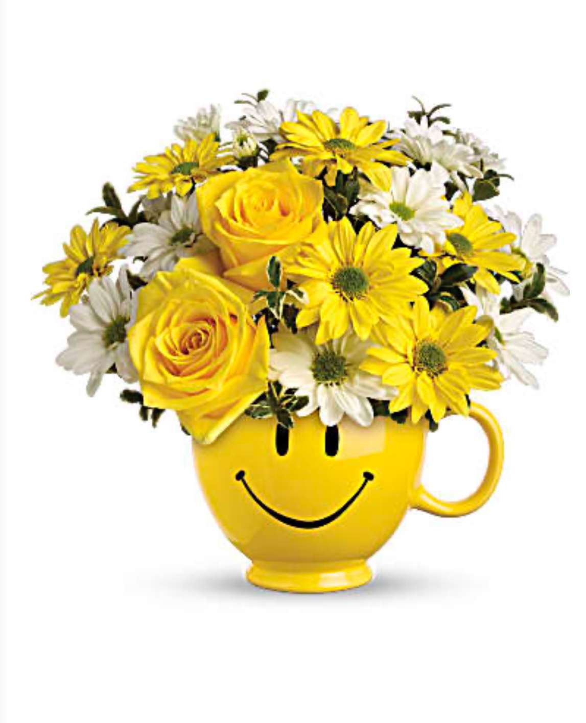 All Smiles - An adorable smiley mug filled with white and yellow seasonal flowers. Will put a smile on someone's face.