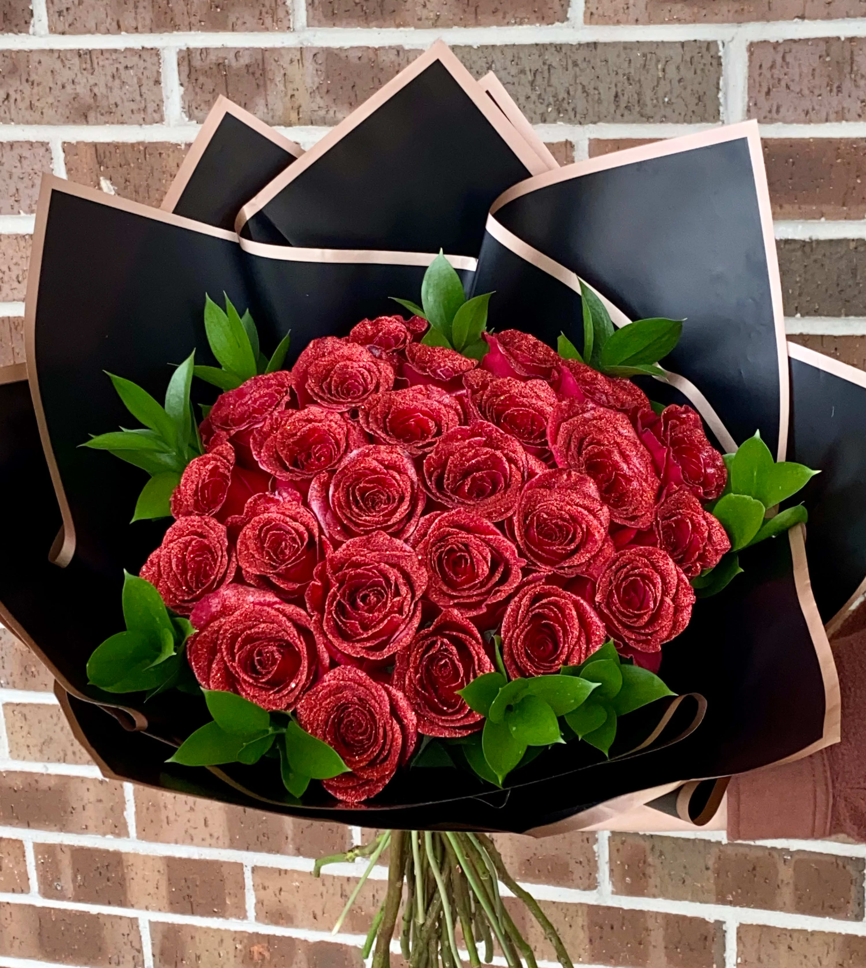 24 Glitter Roses (choose your color)  - 24 Glitter roses wrapped bouquet with your choice of color (let us know in the special instructions box at check out).   Call for unnatural colors (ex. blue, black, green, ect.) $10 fee will apply for these type of colors.  