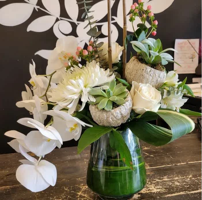 So Succulent - Impress with this artistry!  A beautiful vase arrangement with succulents, roses, mega mums and roses.